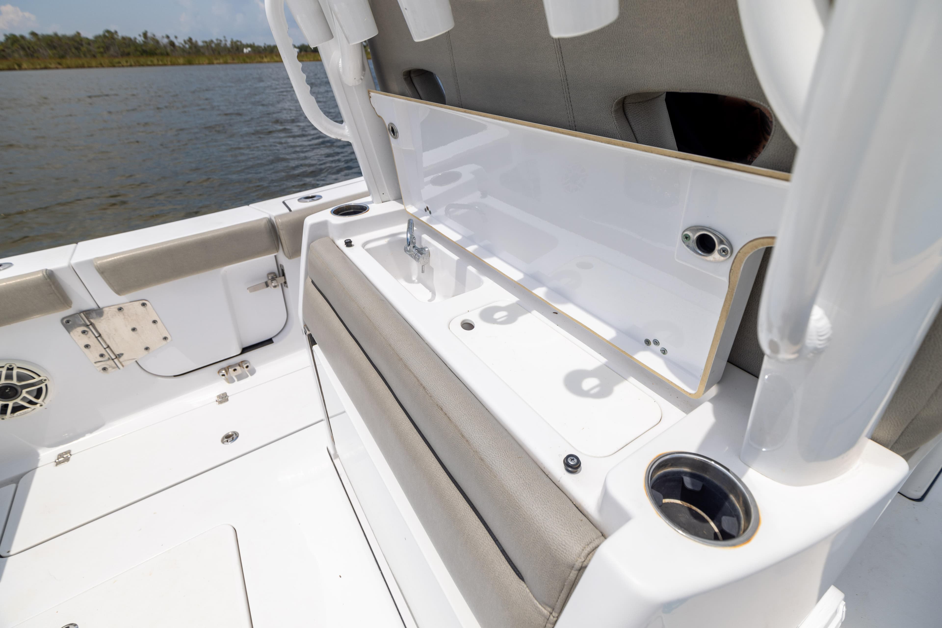 2021 Sportsman Open 302 Center Console boat interior with seating and storage.