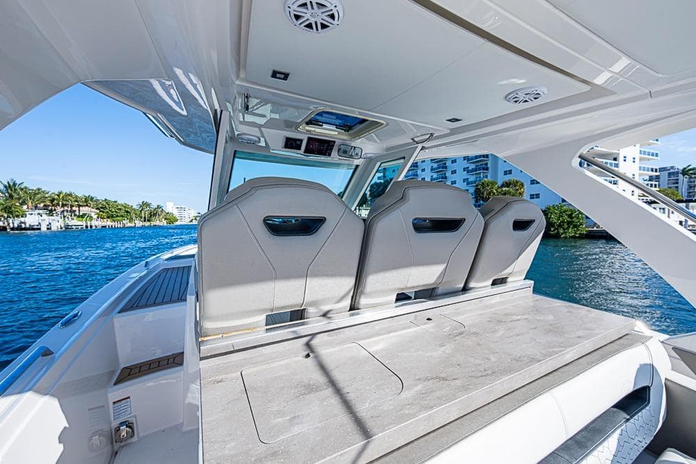2023 Tiara Yachts 34 LS interior with sleek seating and waterfront view.