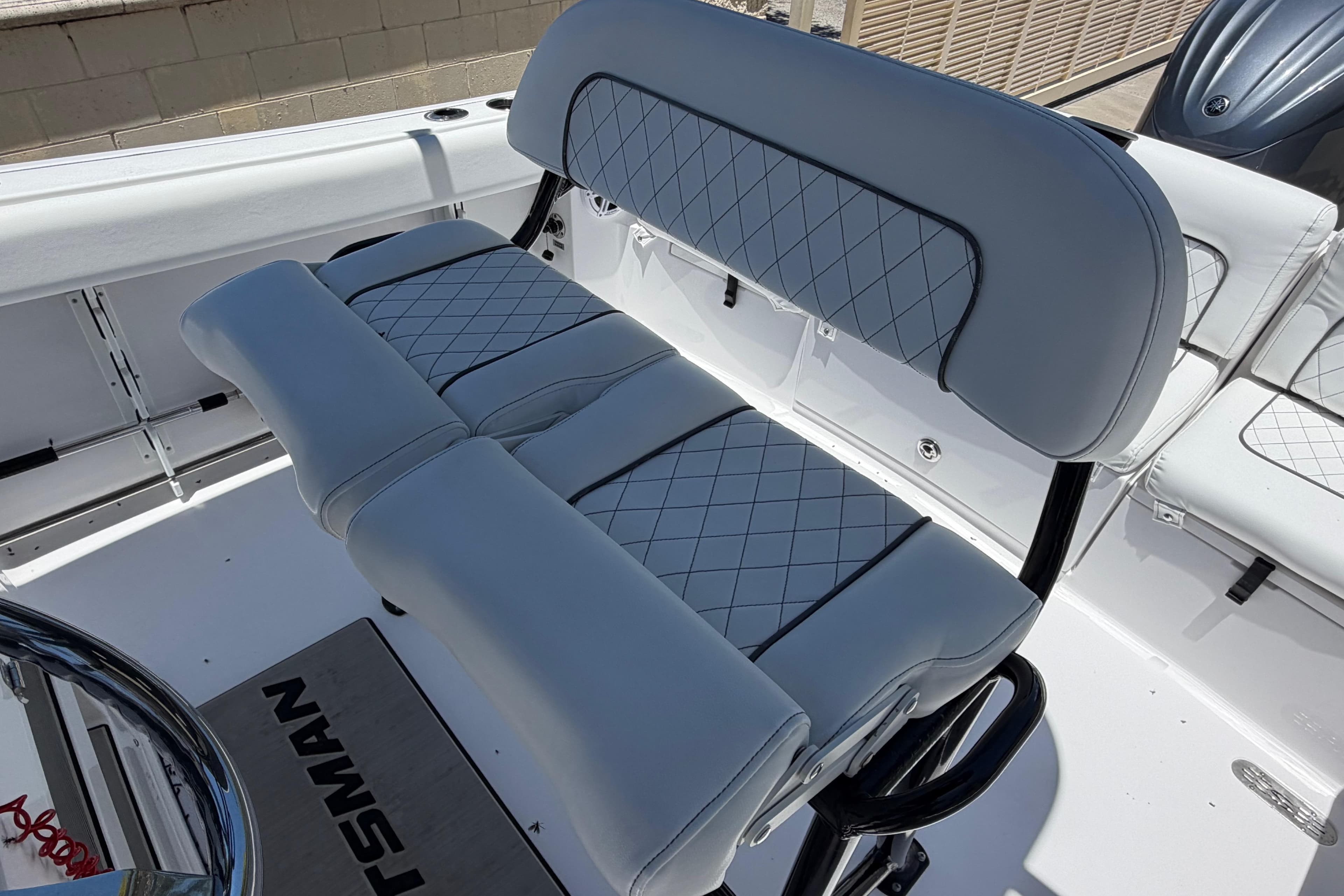 2022 Sportsman Heritage 231 Center Console boat seating with diamond-stitched upholstery.