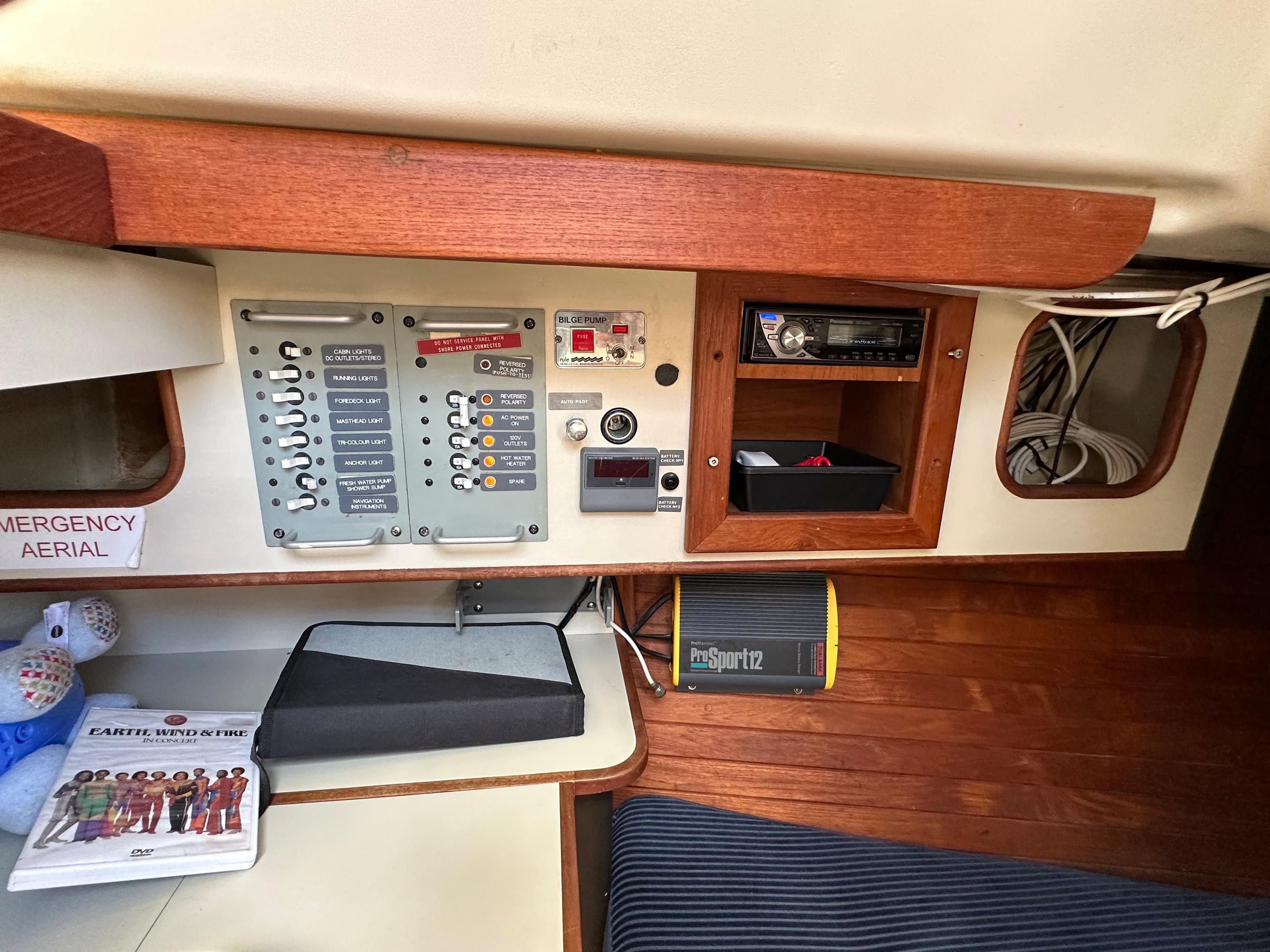 Control panel inside a 1982 C&C 32 sailboat, featuring navigation and communication equipment.
