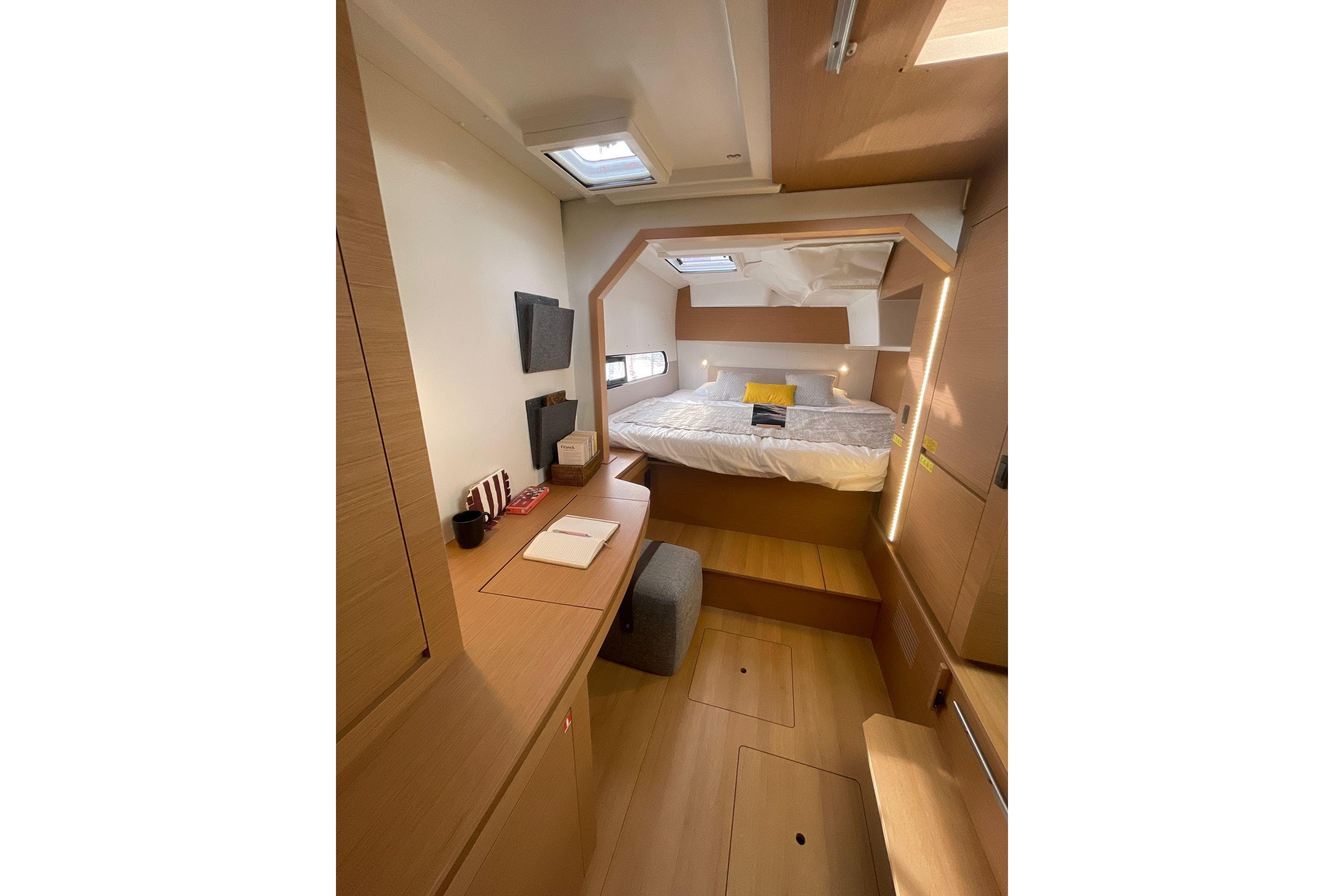 Luxurious interior of 2026 Excess EXCESS 11 yacht with cozy bedroom and modern design.