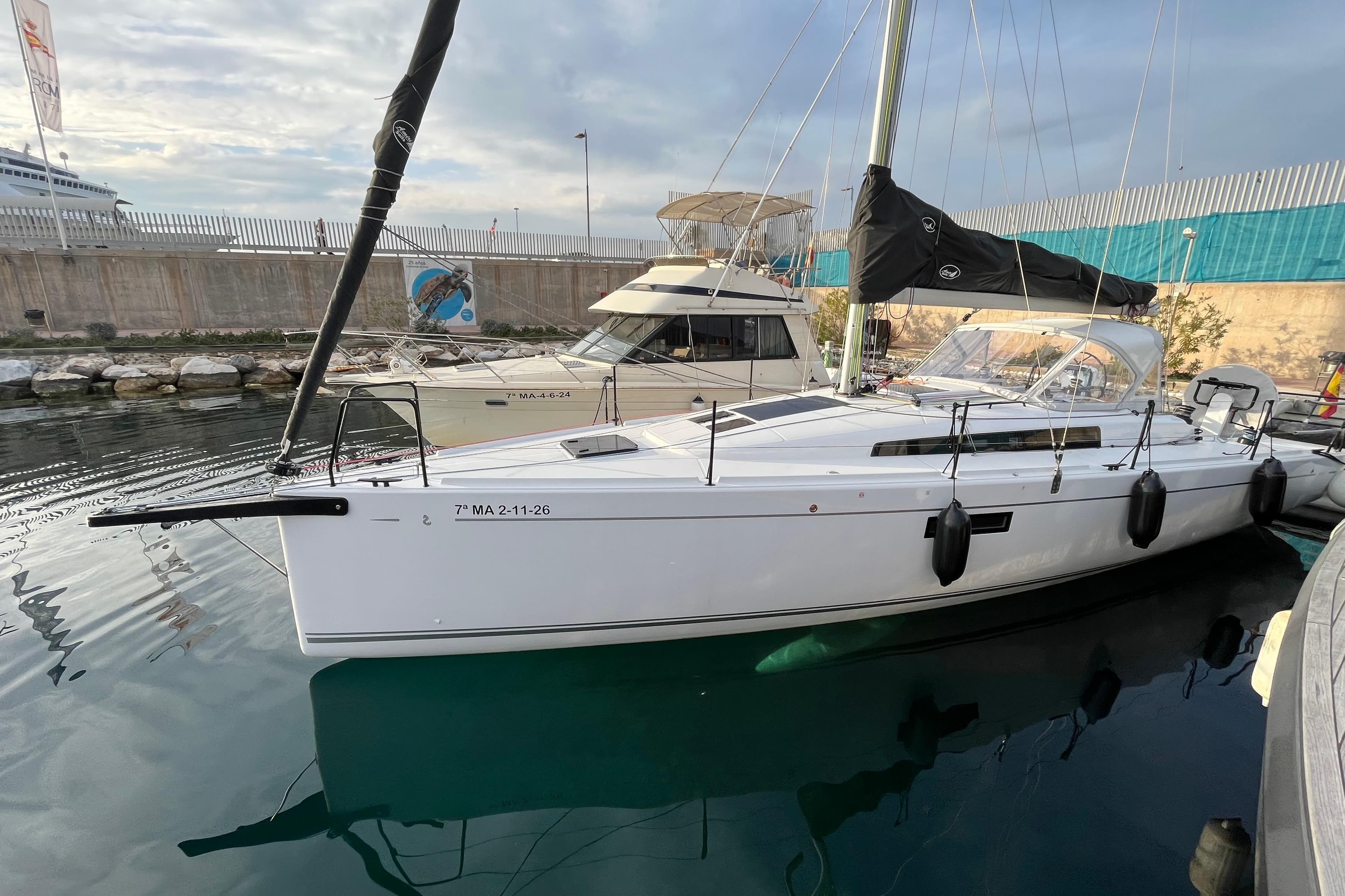 2025 Beneteau First 36 sailboat docked in a marina, side view.