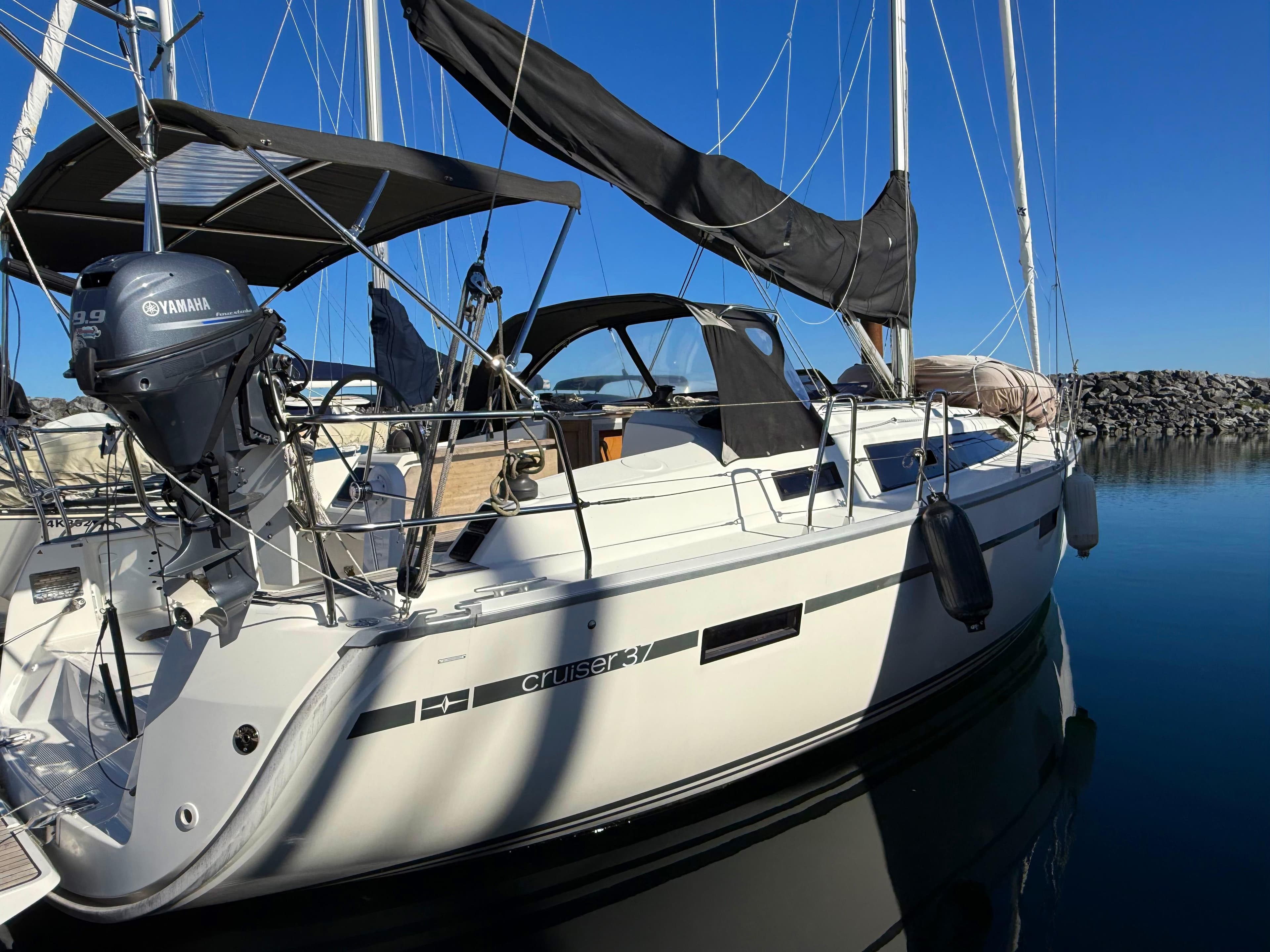 2015 Bavaria Cruiser 37 sailboat docked with Yamaha outboard motor.