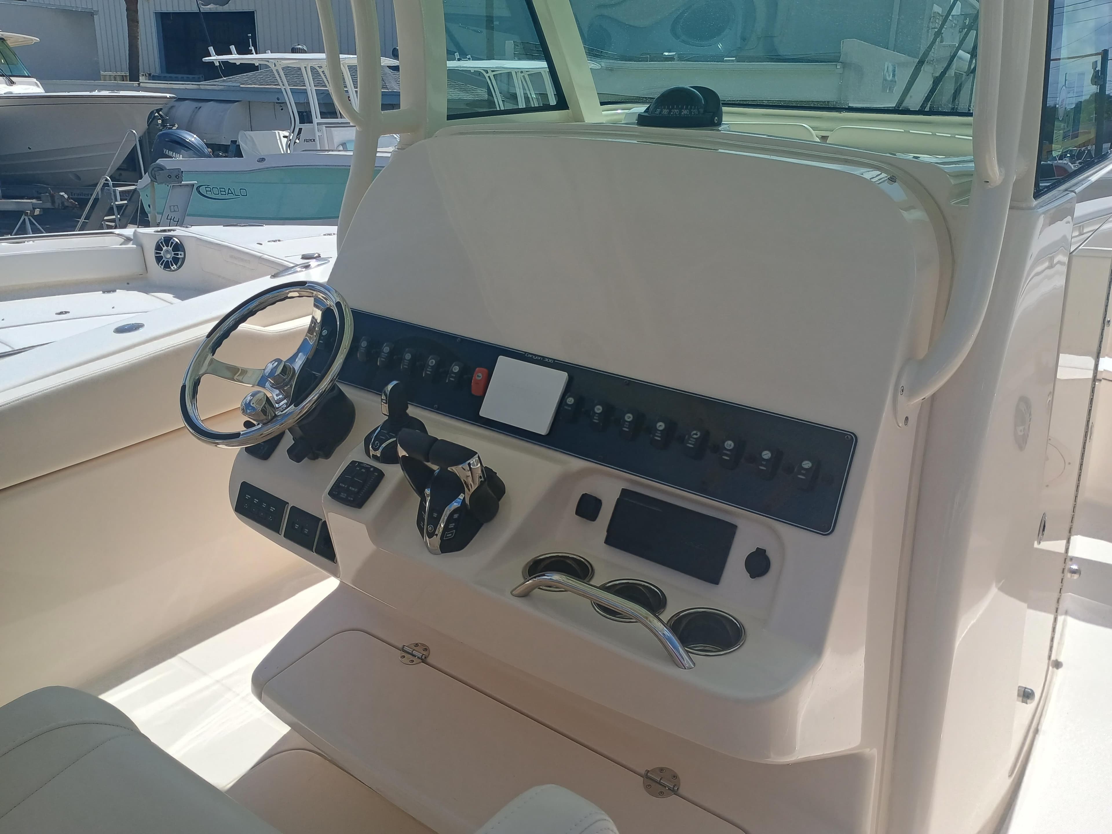 2025 Grady-White Canyon 306 boat dashboard with steering wheel and controls.
