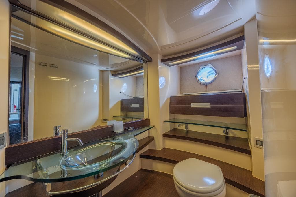 Luxurious bathroom in 2009 Azimut 68S yacht with modern fixtures and elegant design.