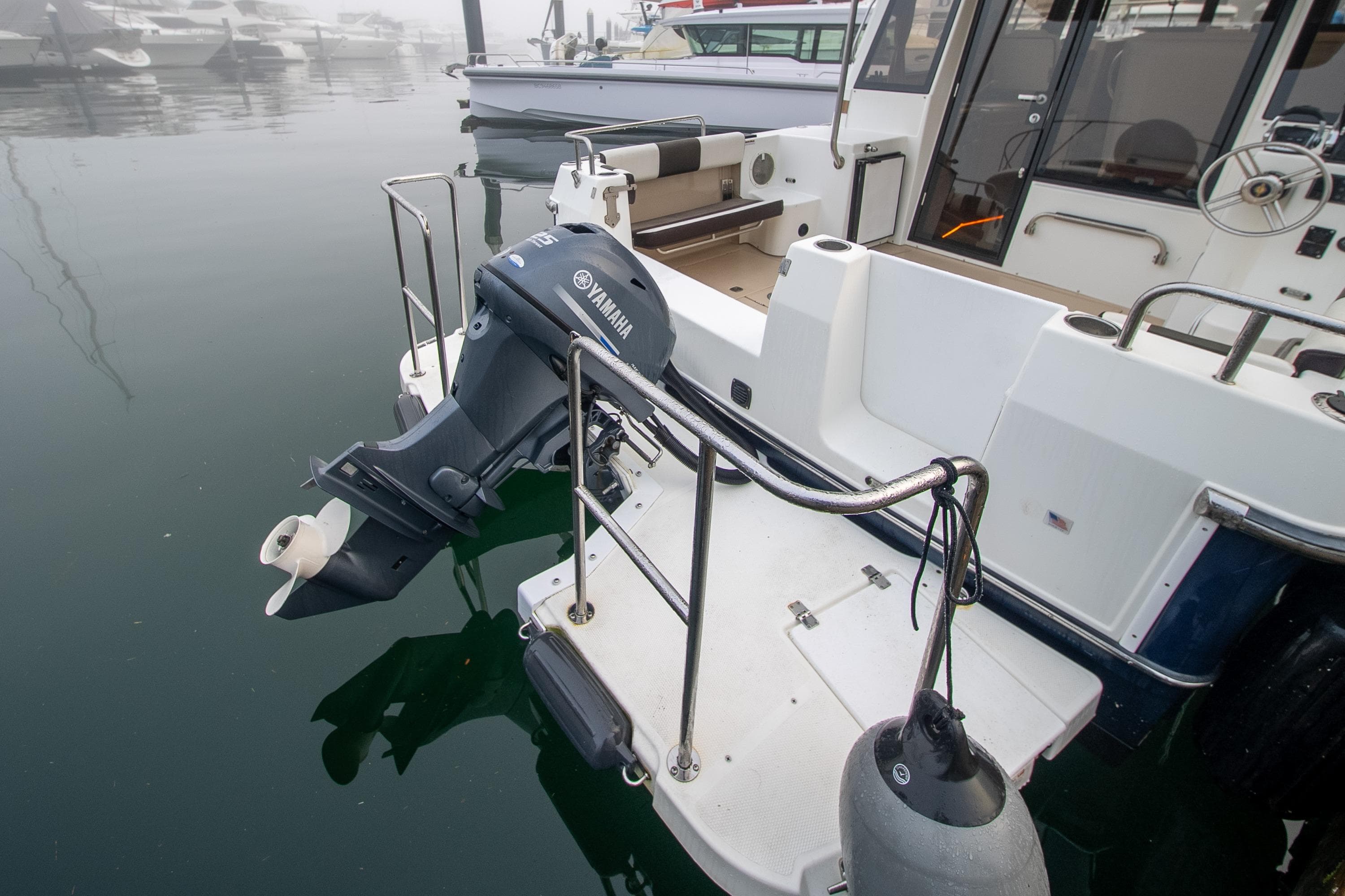 2016 Ranger Tugs R-29 with Yamaha outboard motor at a marina.