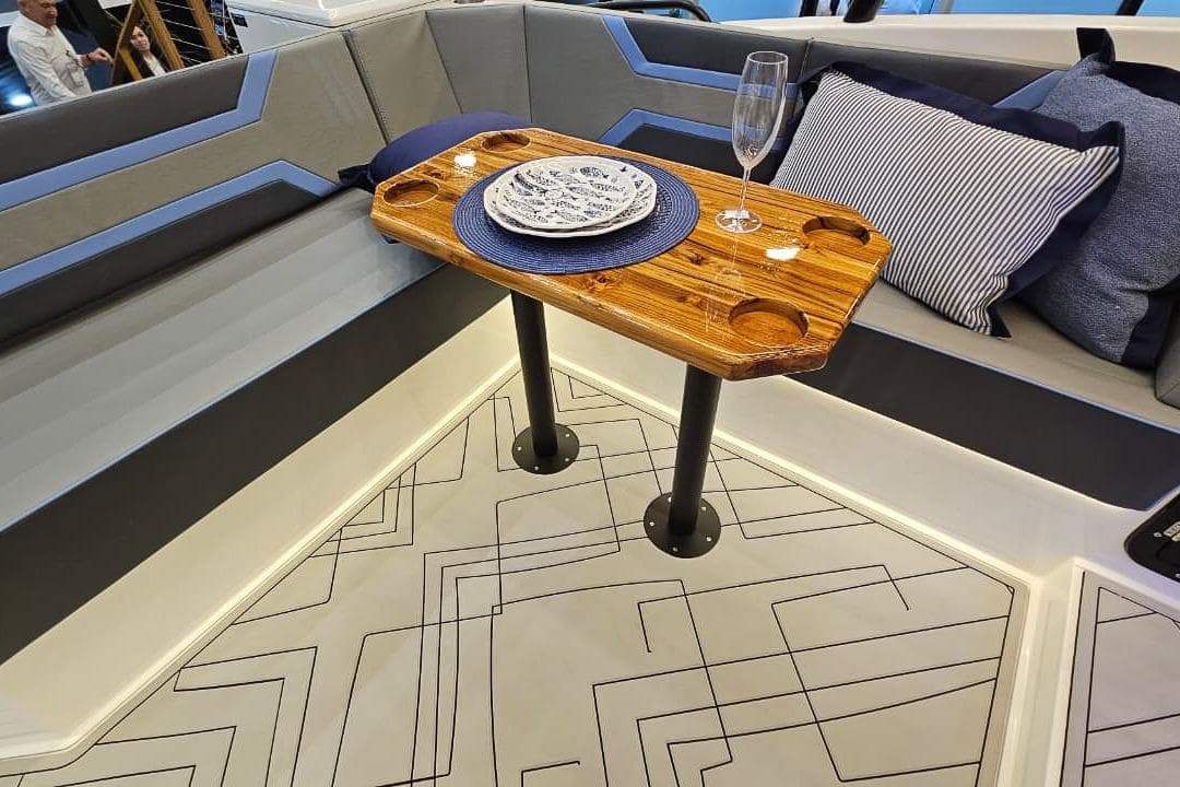 Luxurious Hanover 327 yacht interior with elegant seating, wooden table, and stylish decor, 2027 model.