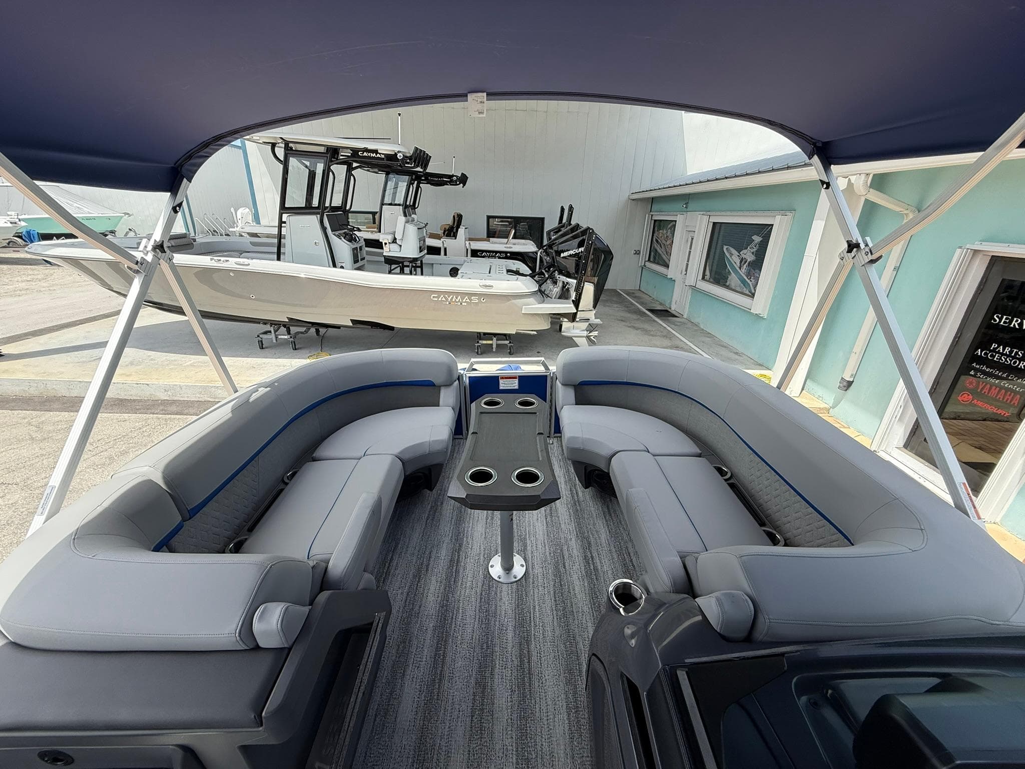 2026 Bennington 22 MSB pontoon boat interior with gray seating and table.