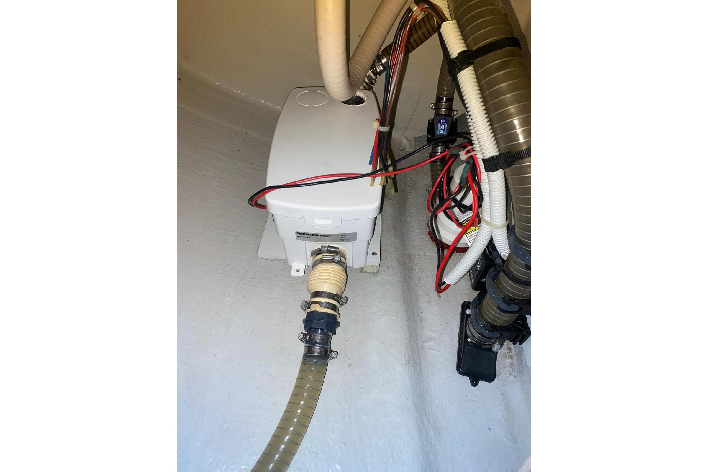 Electrical and plumbing components inside a 2014 FONTAINE PAJOT 63 yacht.