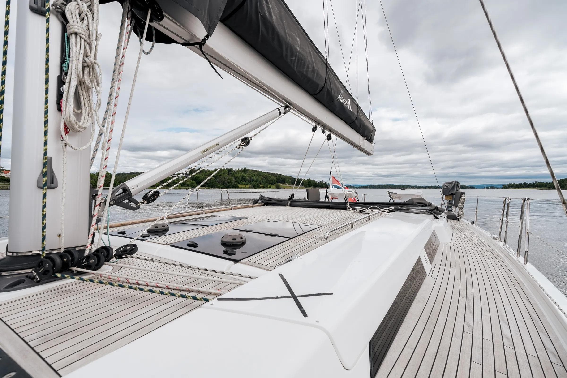 2019 Hanse 548 yacht deck with sleek design and scenic water view.