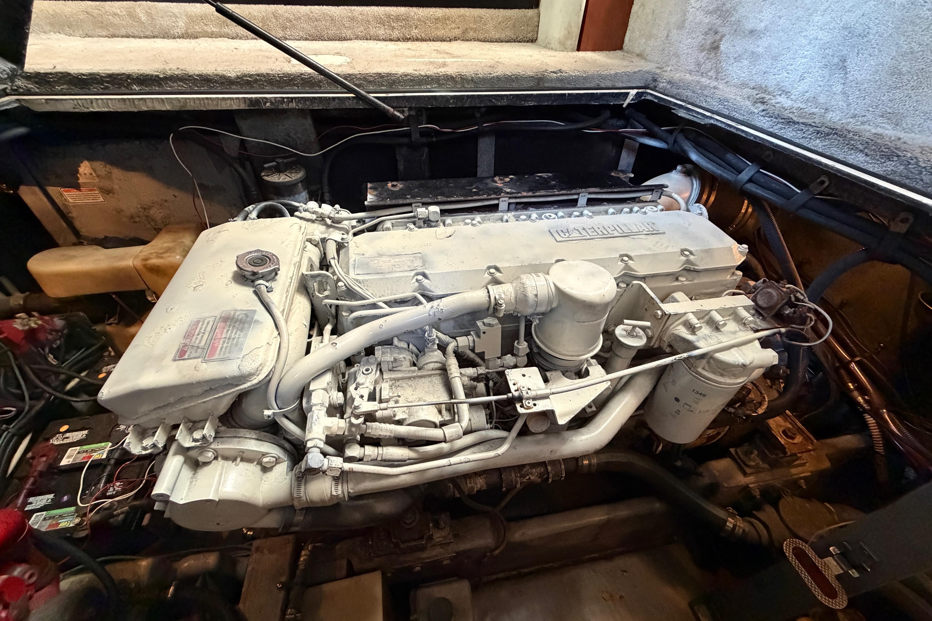 Engine compartment of a 1997 Sea Ray 370 Aft Cabin boat, showcasing detailed machinery.