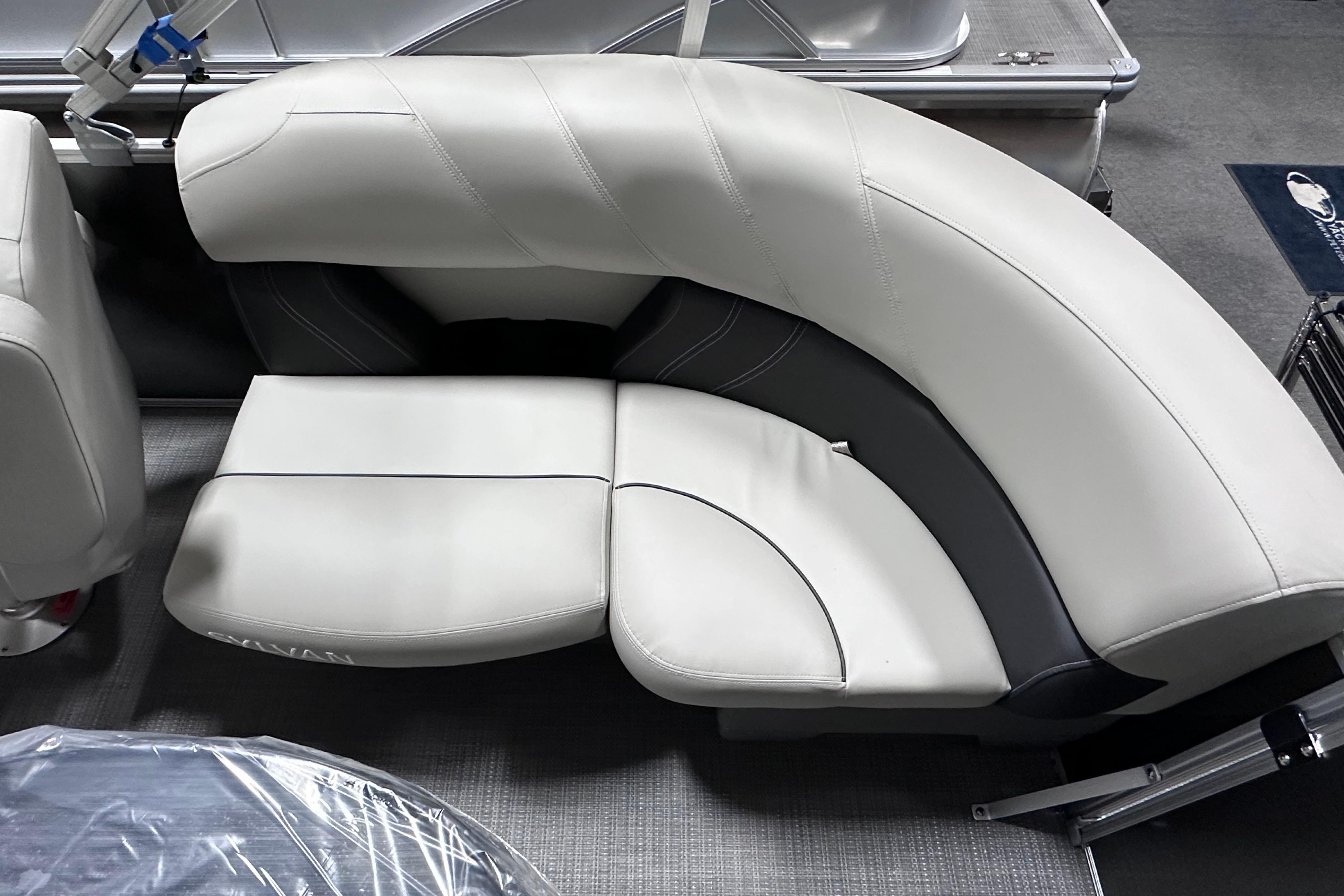 Luxurious seating on 2026 Sylvan Mirage 820 LZ pontoon boat, featuring elegant curved design.