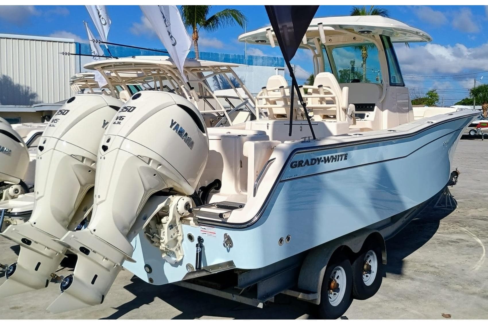 2025 Grady-White Canyon 306 boat with twin Yamaha engines on a trailer.