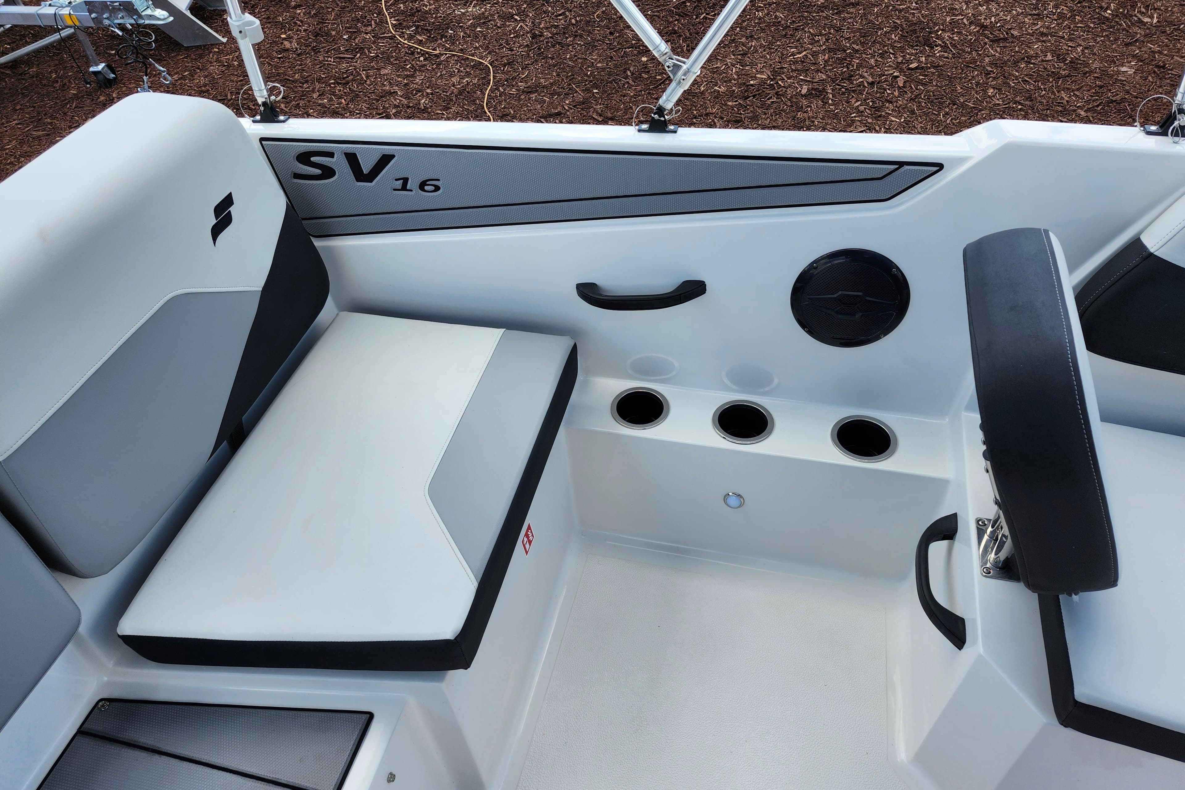 Interior of 2026 Starcraft SV 16 OB boat with seating and cup holders.