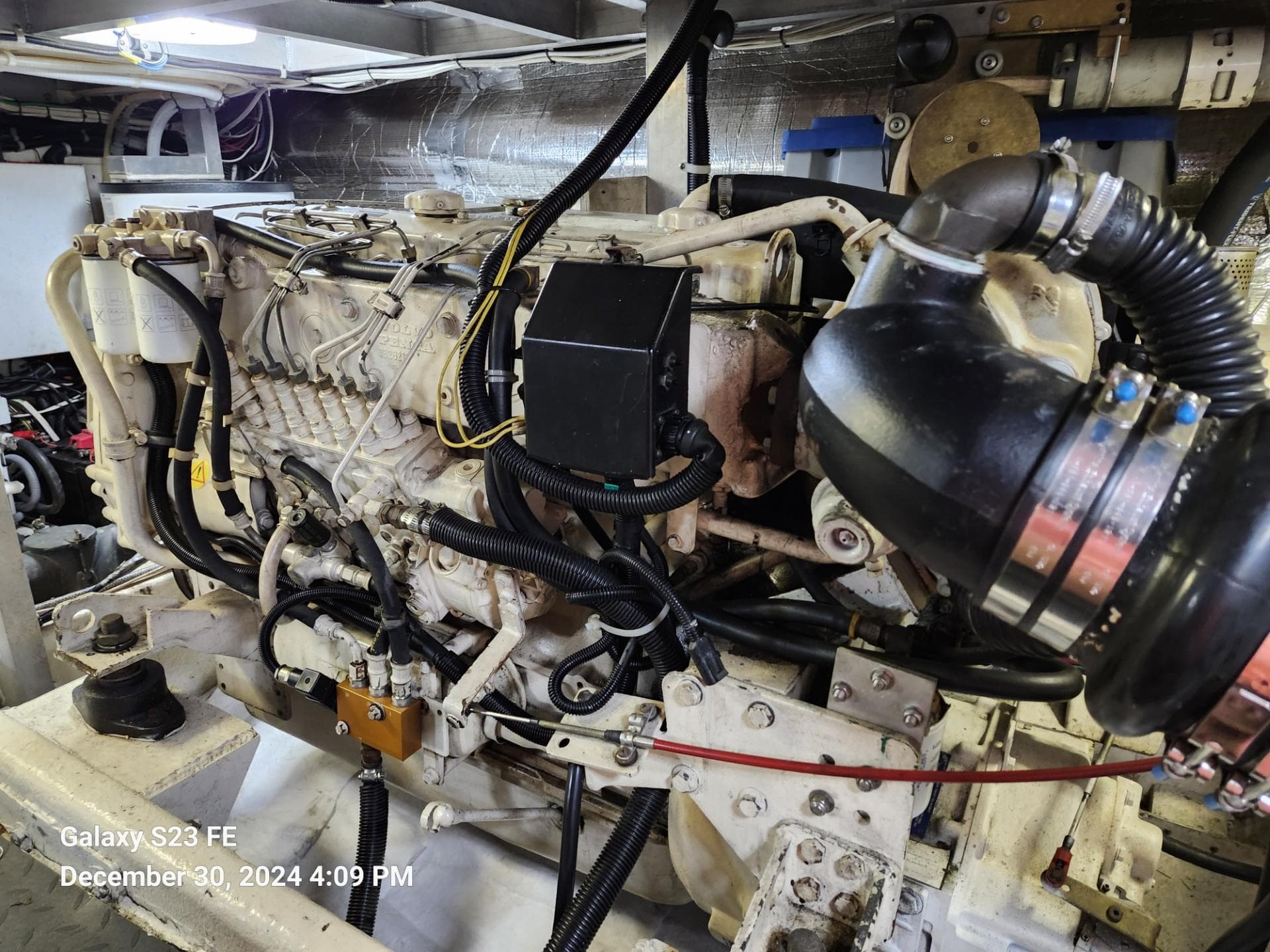 Engine room of 1999 Navigator 4800 CLASSIC yacht, showcasing detailed machinery and components.