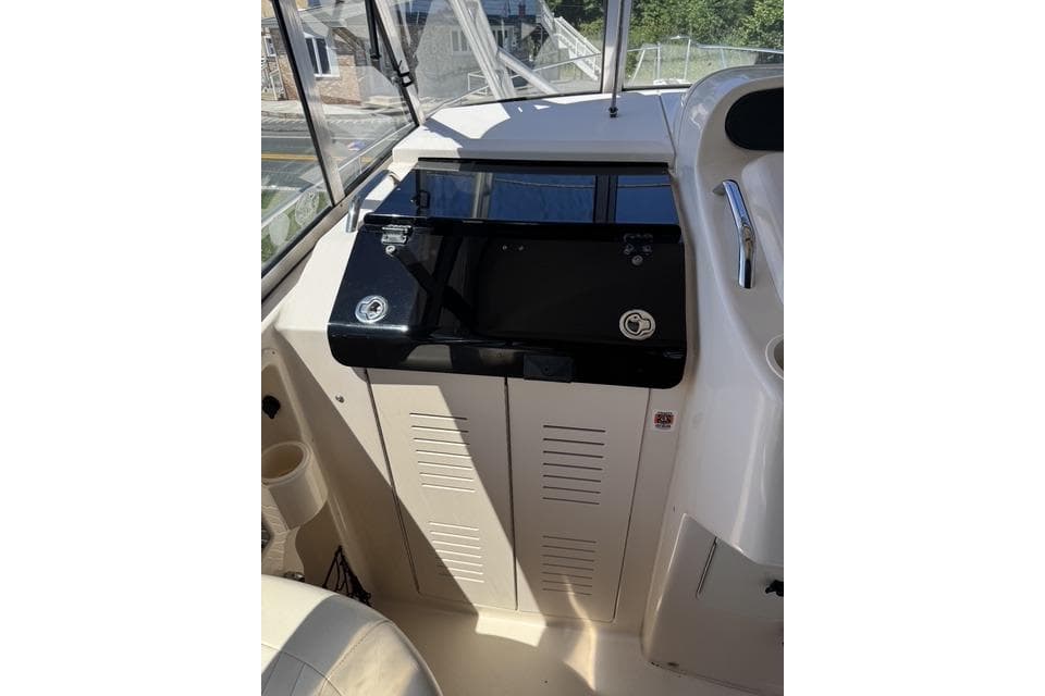 2008 Grady White 330 Express helm with modern controls and navigation equipment.