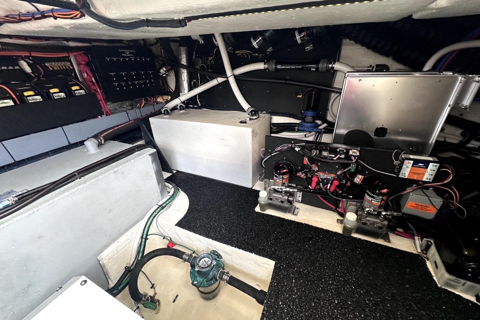 Engine compartment of 2021 Regal 38 XO boat with wiring and components.