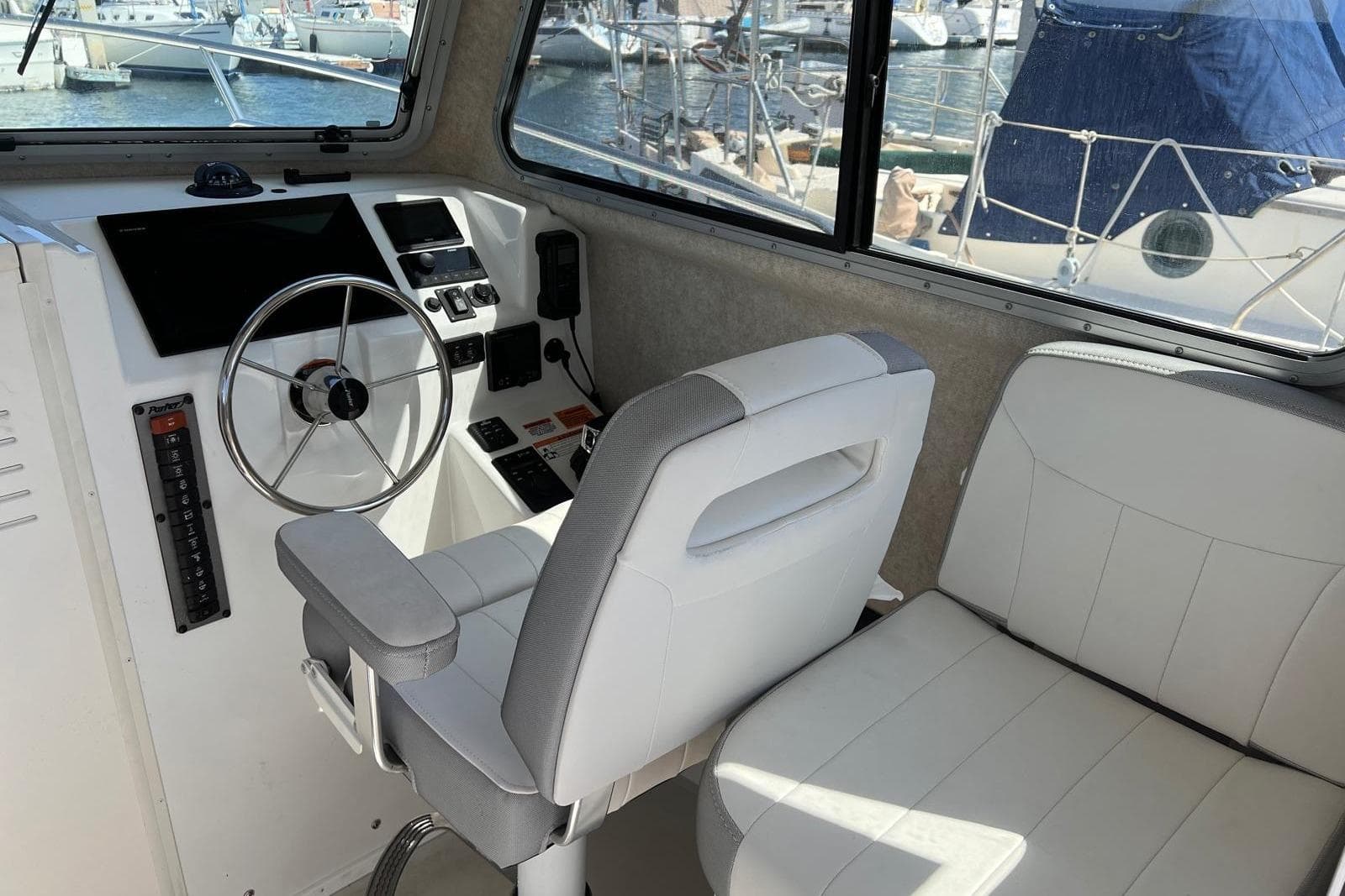 2023 Parker 2820 XLD Sport Cabin interior with steering wheel and seating.