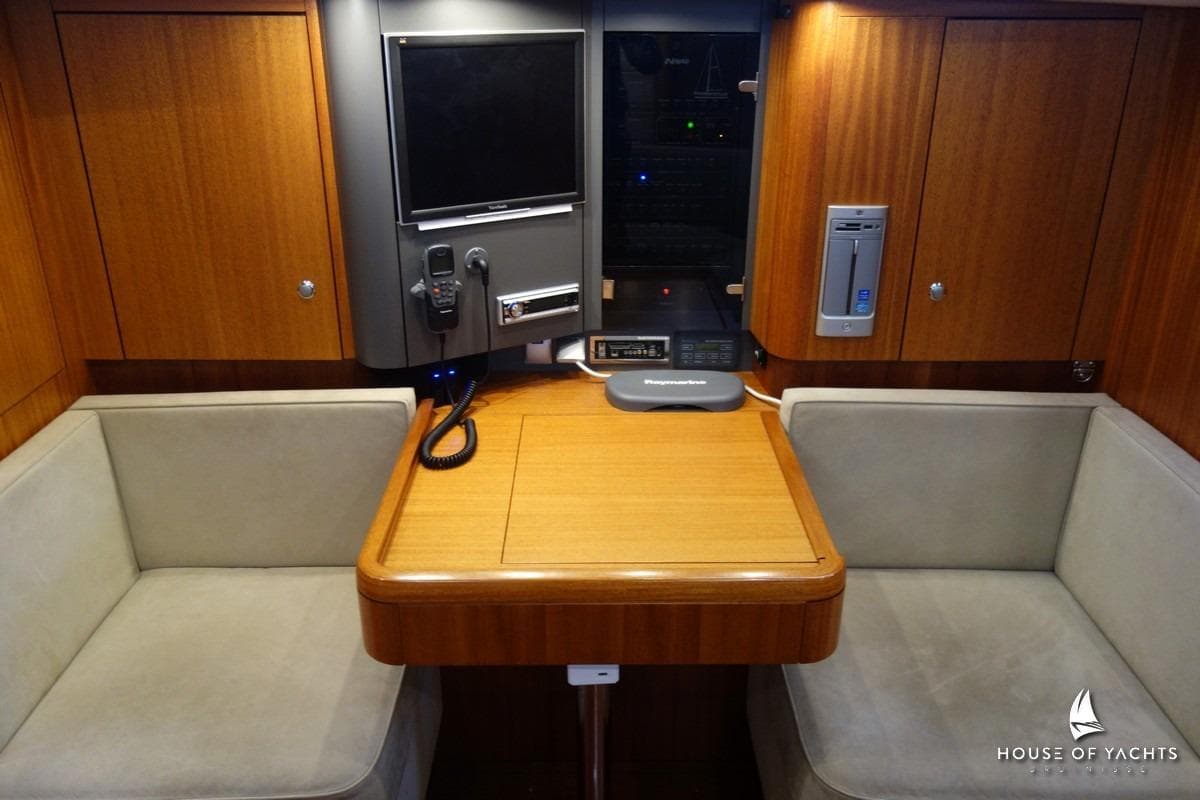 Interior of 2007 Najad 440 AC yacht with wooden table and seating area.