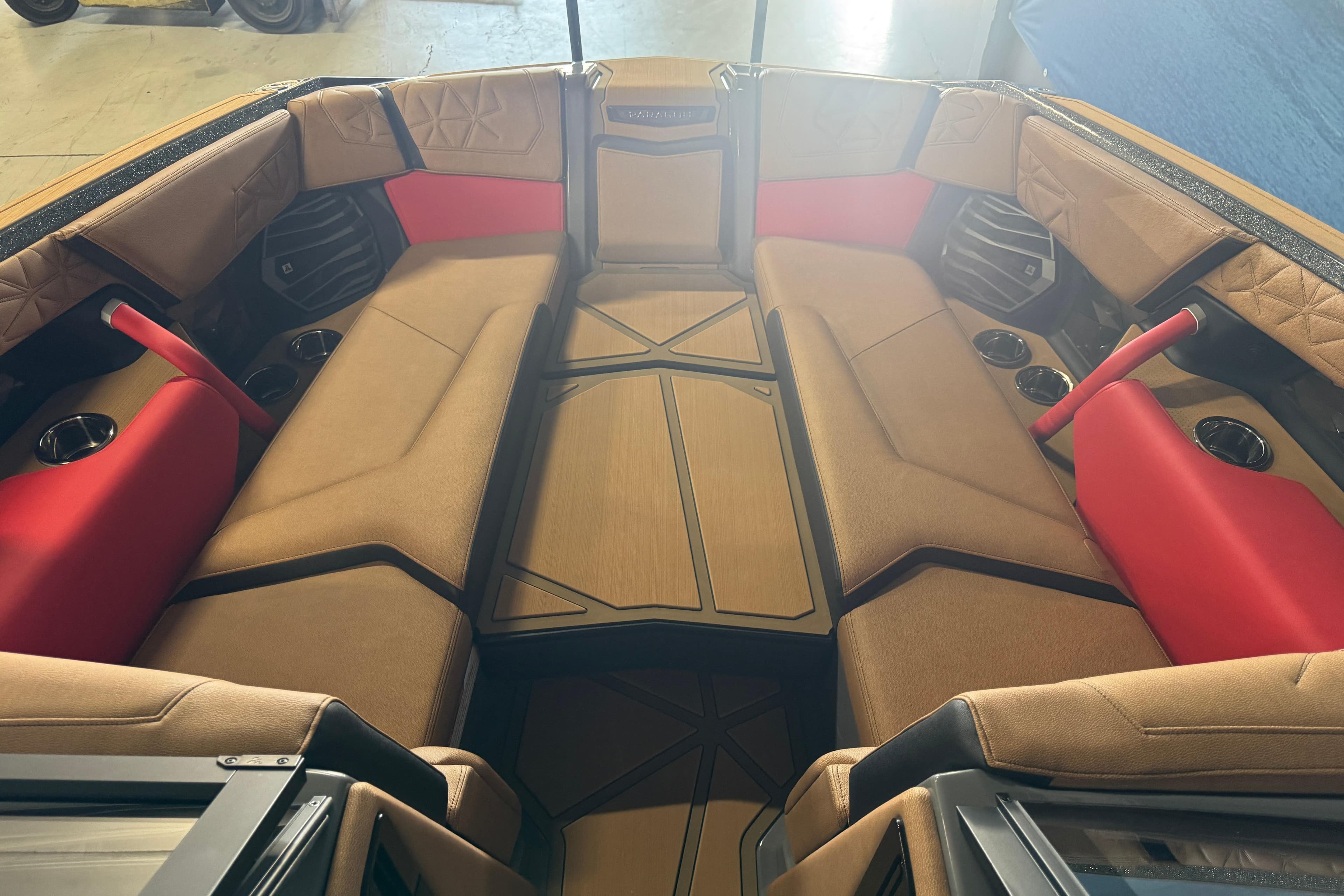 2026 Nautique Super Air Nautique G25 Paragon interior with tan and red seating.