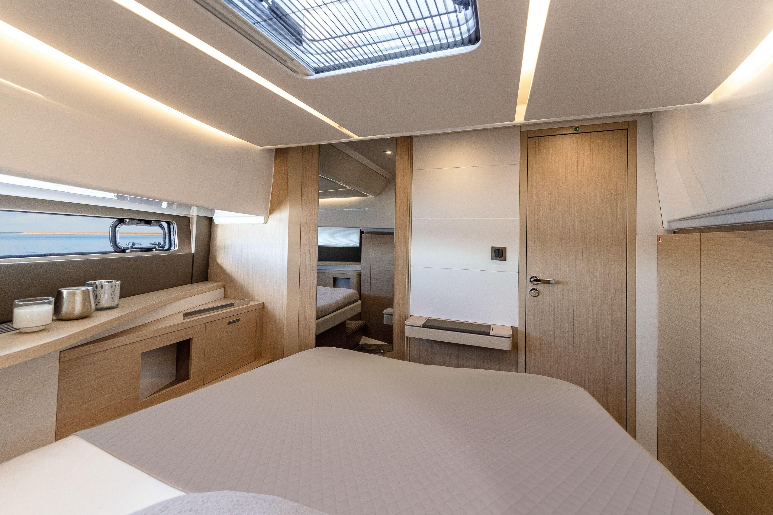 Luxurious interior of 2025 Jeanneau DB/37 IB yacht cabin with modern design.