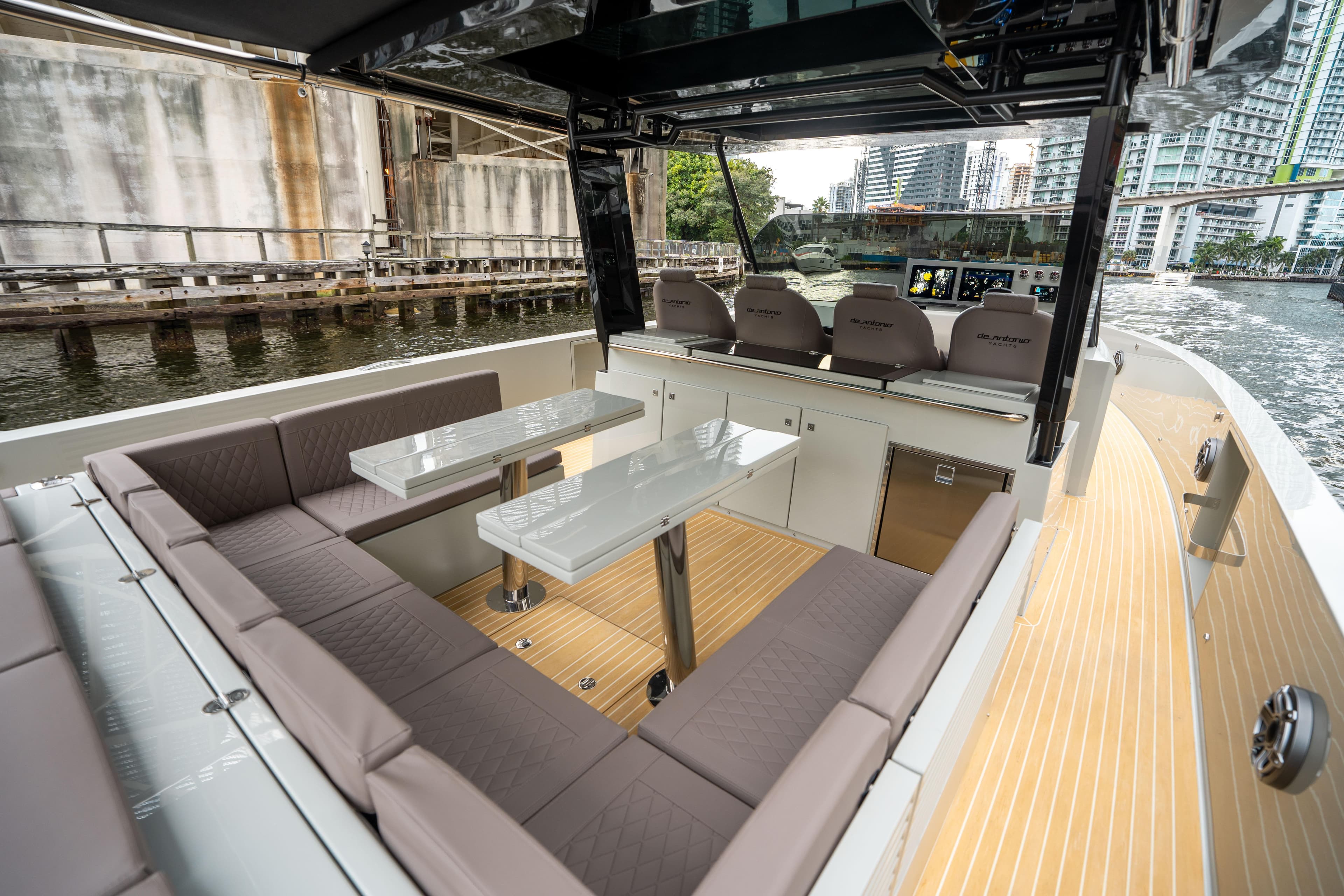 2025 De Antonio Yachts D42 Open, luxurious seating, modern design, waterfront view.