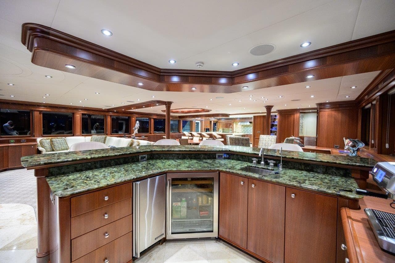 Luxurious interior of 2011 C & G Boatworks Explorer yacht with elegant wood and granite finishes.