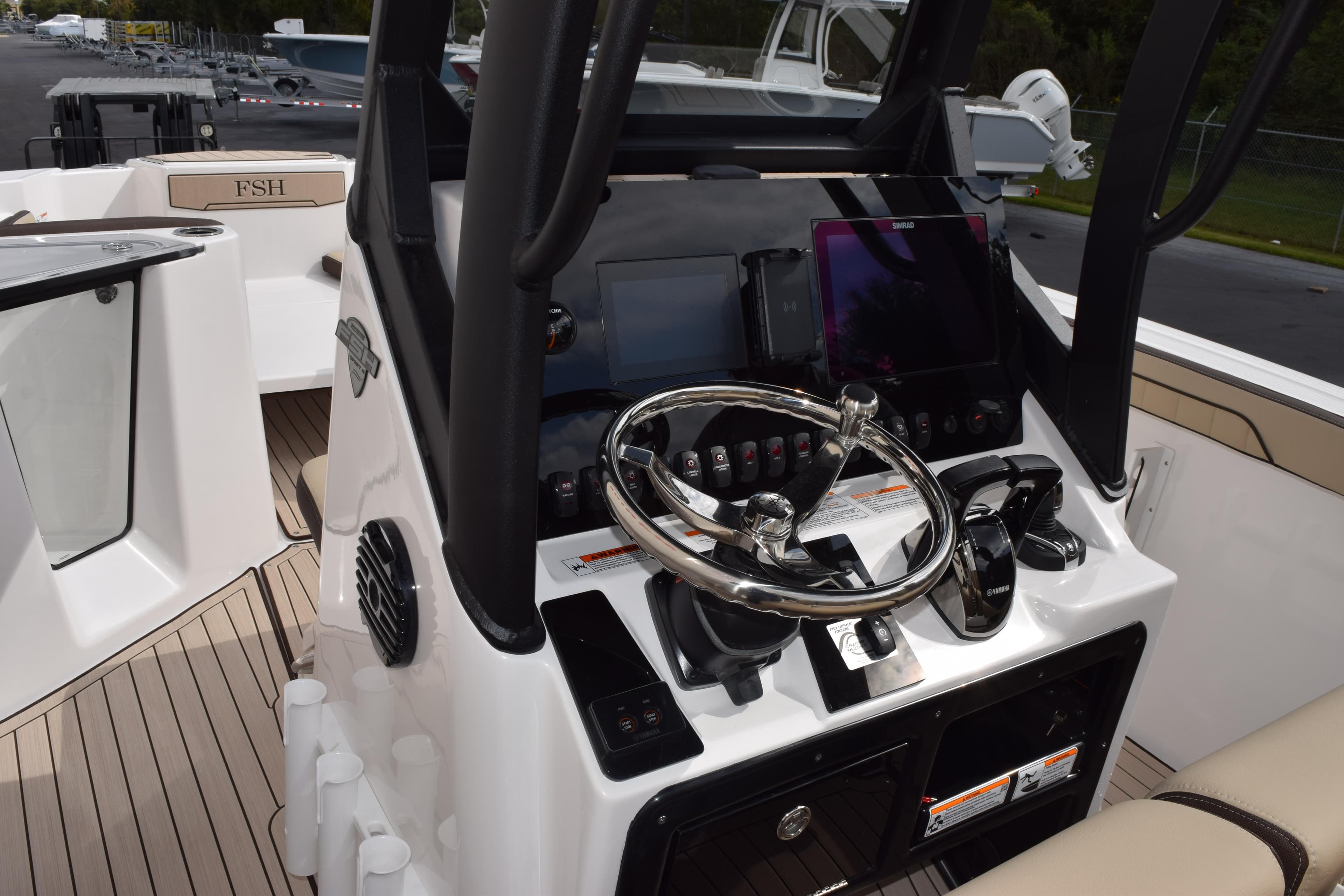 2026 Yamaha Boats 255 FSH Sport H dashboard with steering wheel and controls.
