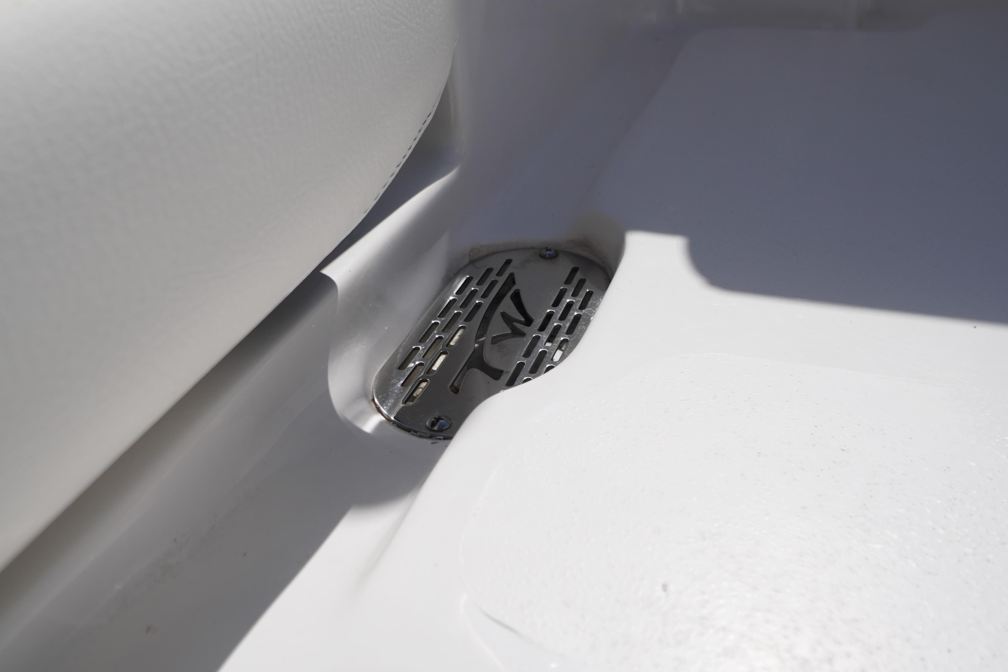 2024 Tidewater 232 CC Adventure boat drain detail with metal grate.