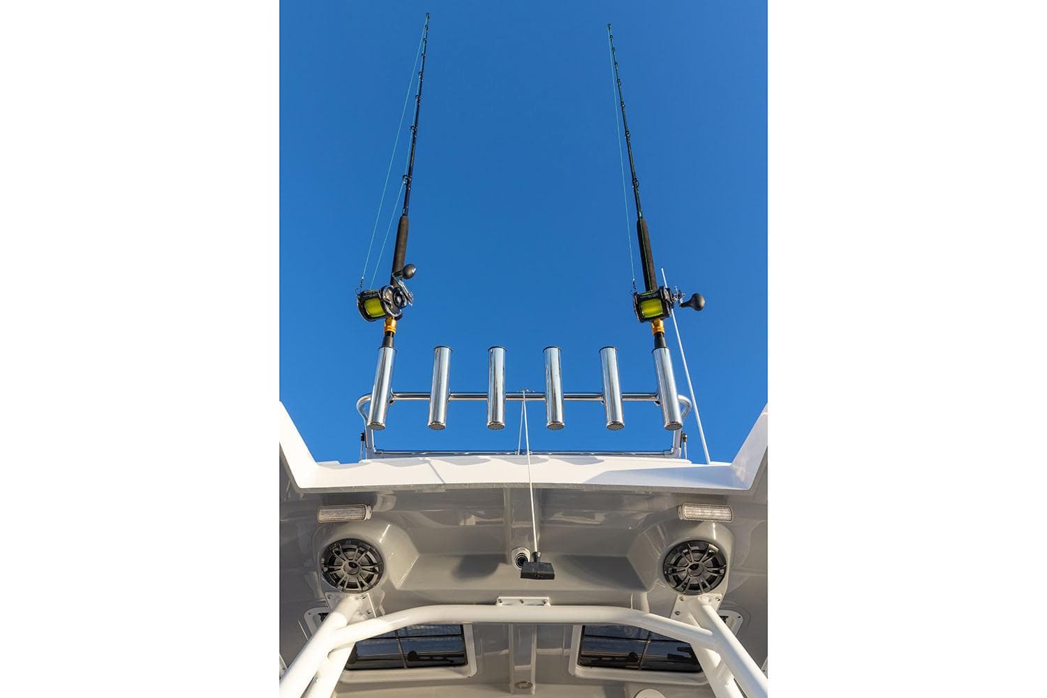 Manufacturer Provided Image: Fishing rods on Solara S-250 CW boat against clear blue sky, 2025 model.