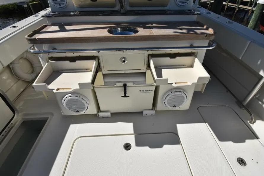 2012 Hydra-Sports 4200 Siesta boat interior with storage compartments and speakers.