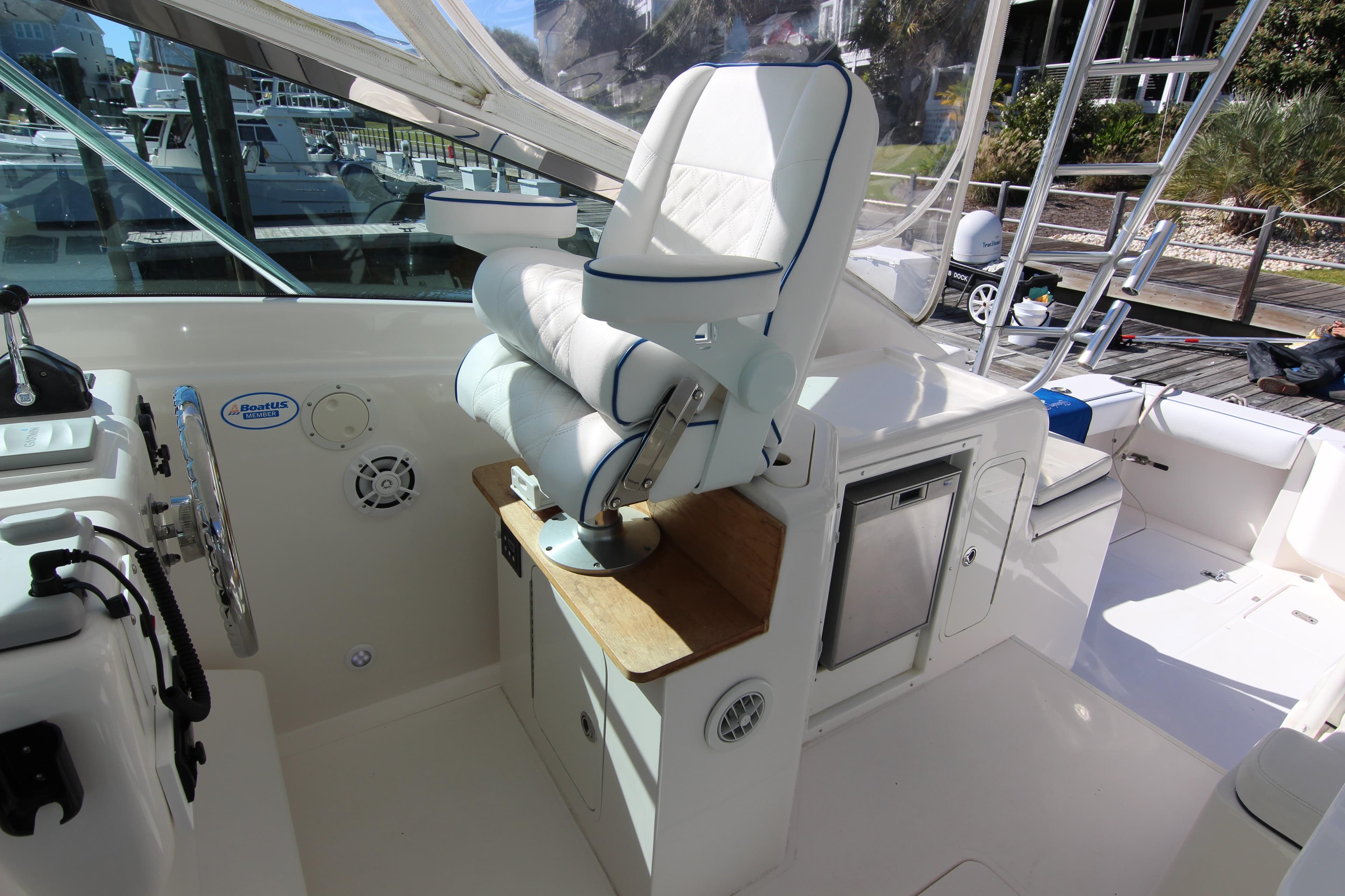 2008 Bertram 360 boat interior with helm seat and control panel.