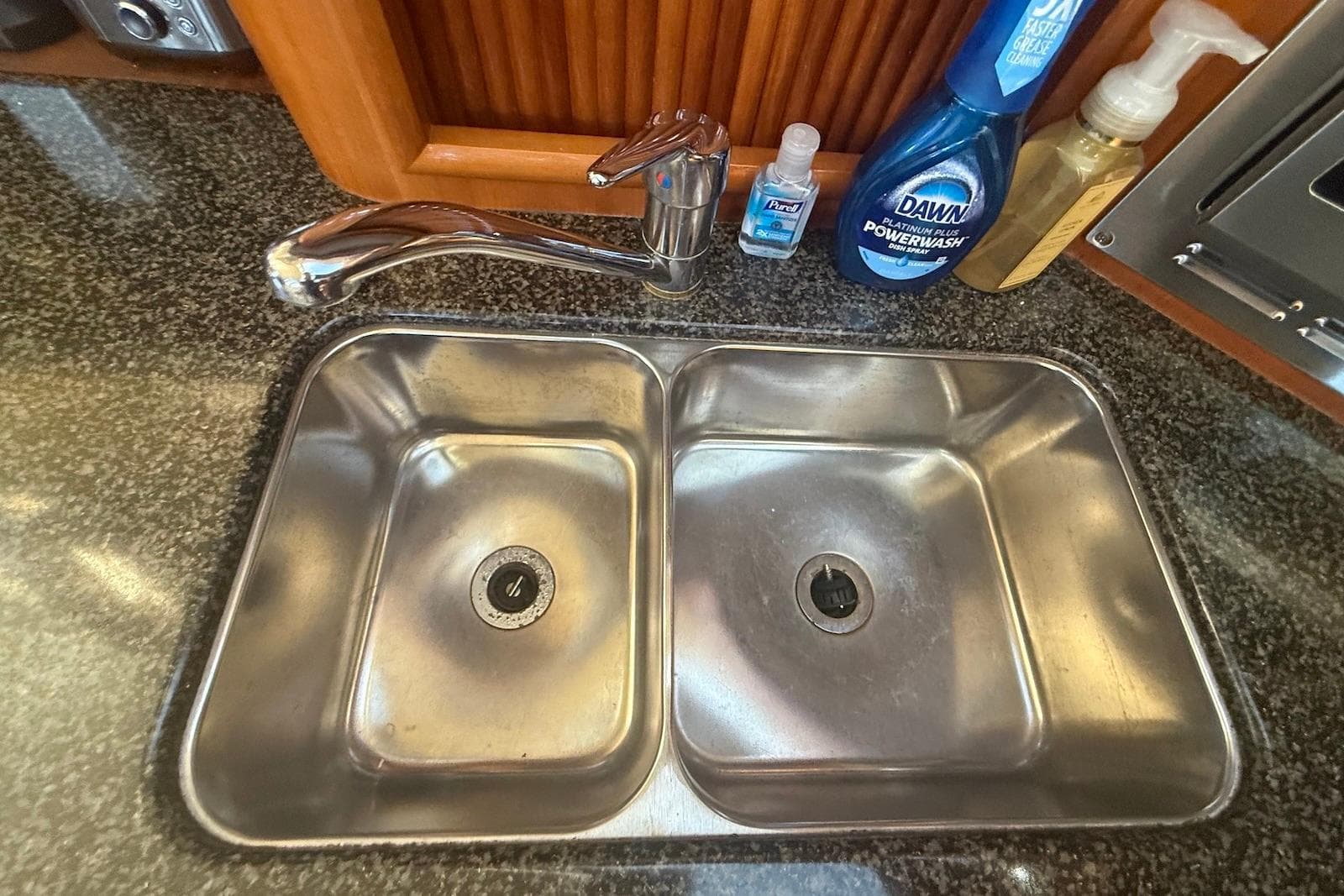 Stainless steel double sink in 2004 Carver 396 Motor Yacht kitchen area.
