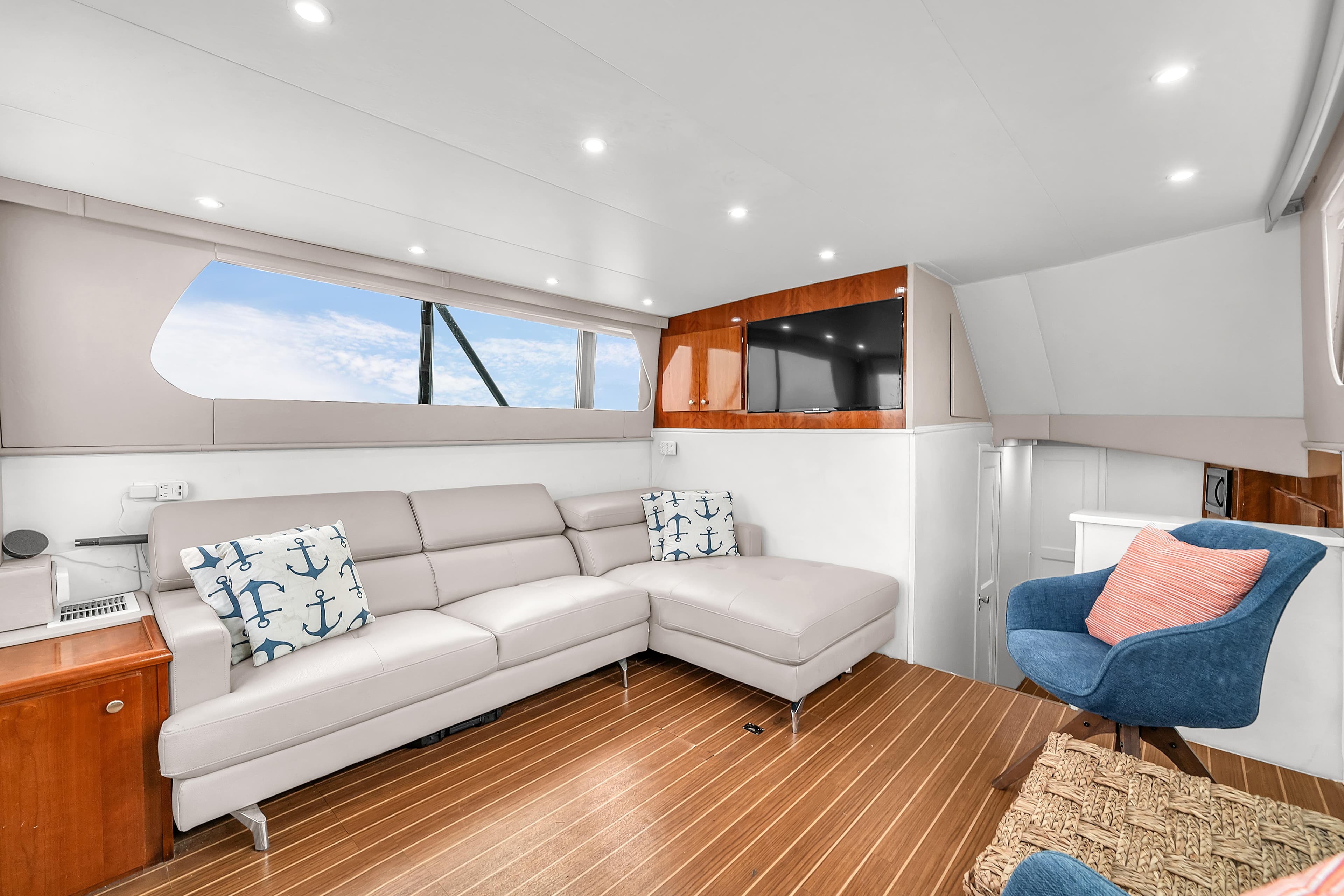 Luxurious interior of 1978 Hatteras 42 Convertible yacht with modern seating and decor.