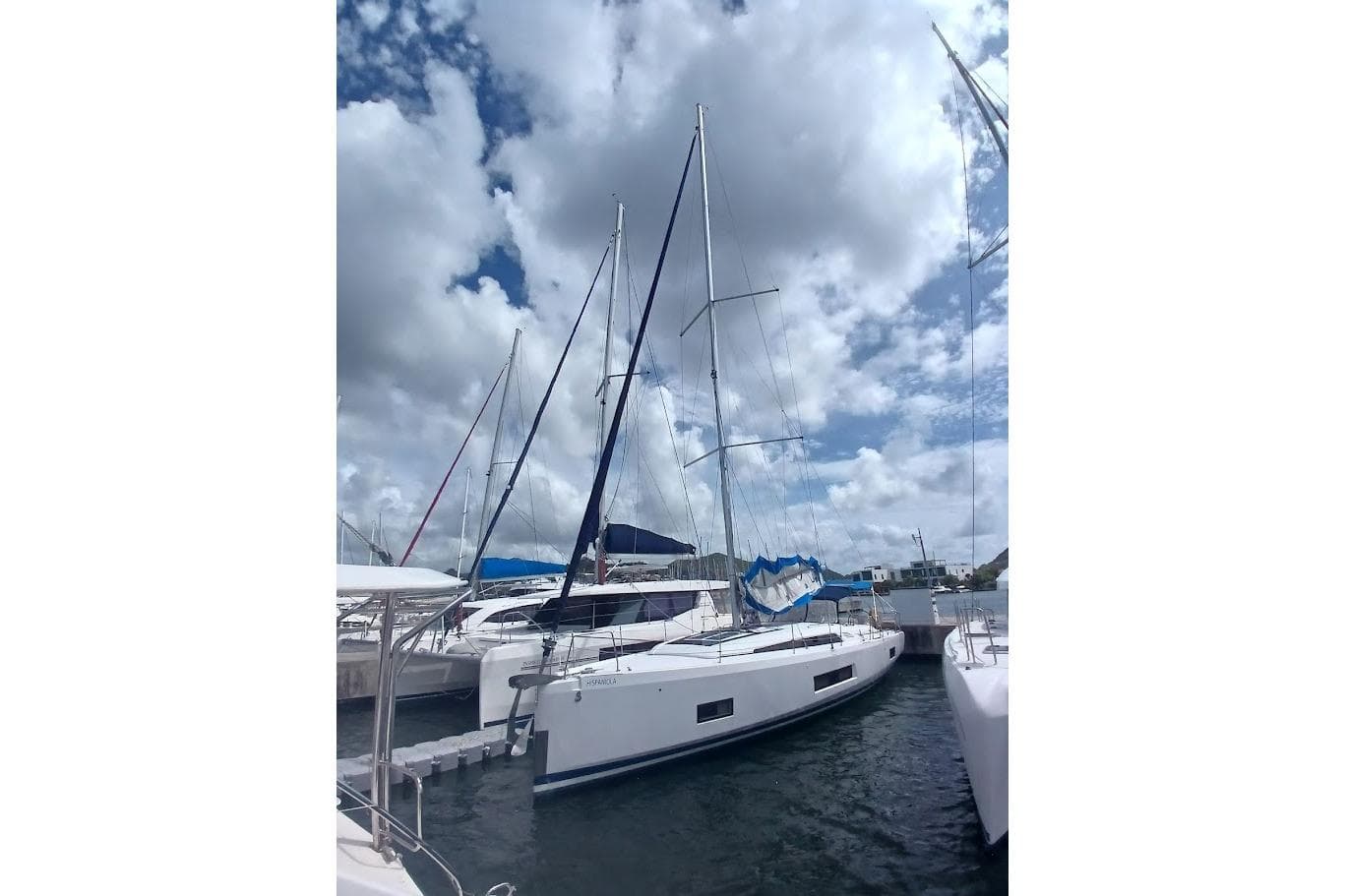 2020 Beneteau Oceanis 46.1 sailboat docked under a cloudy sky.