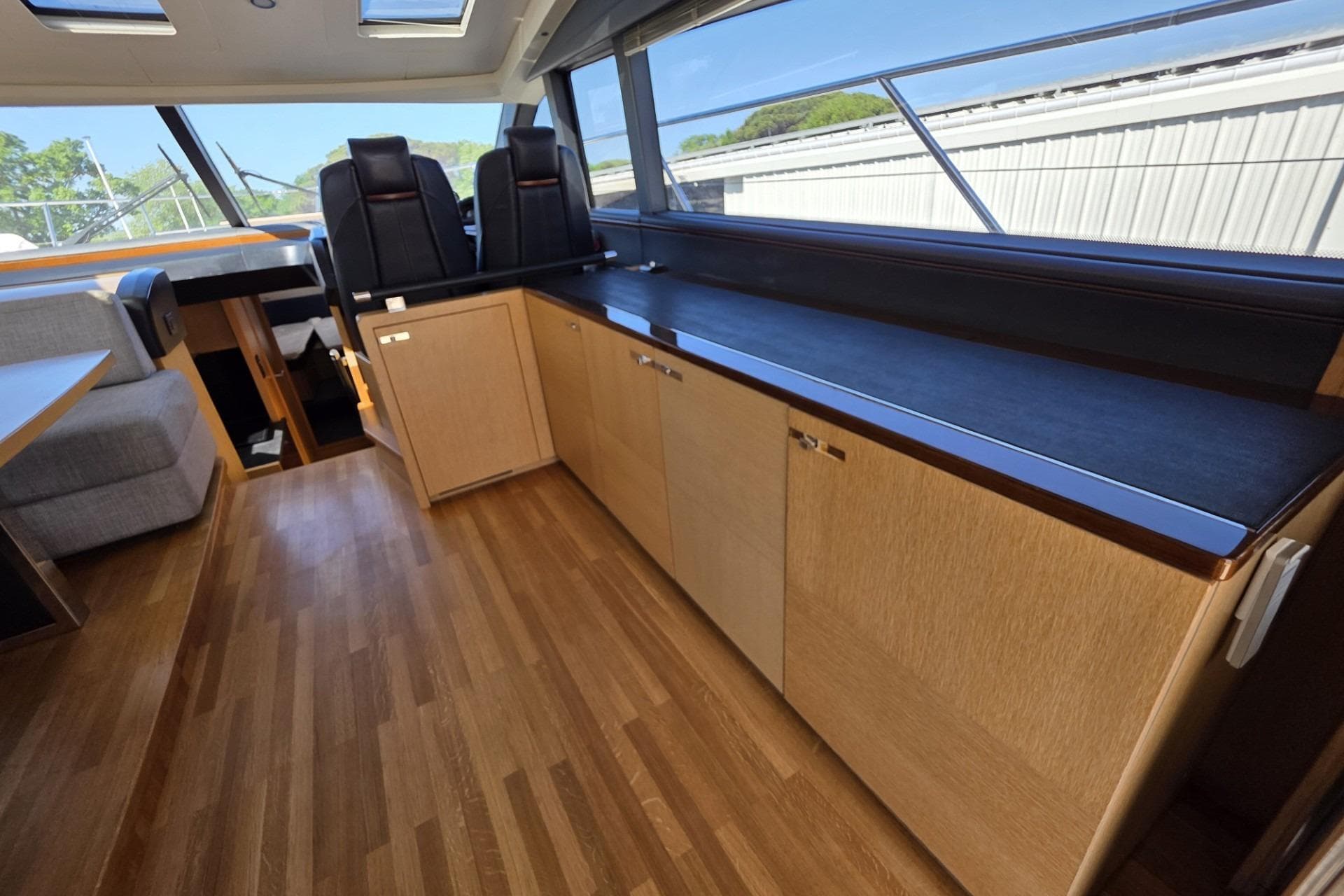 Luxurious interior of 2012 Princess V57 yacht with sleek wood flooring.