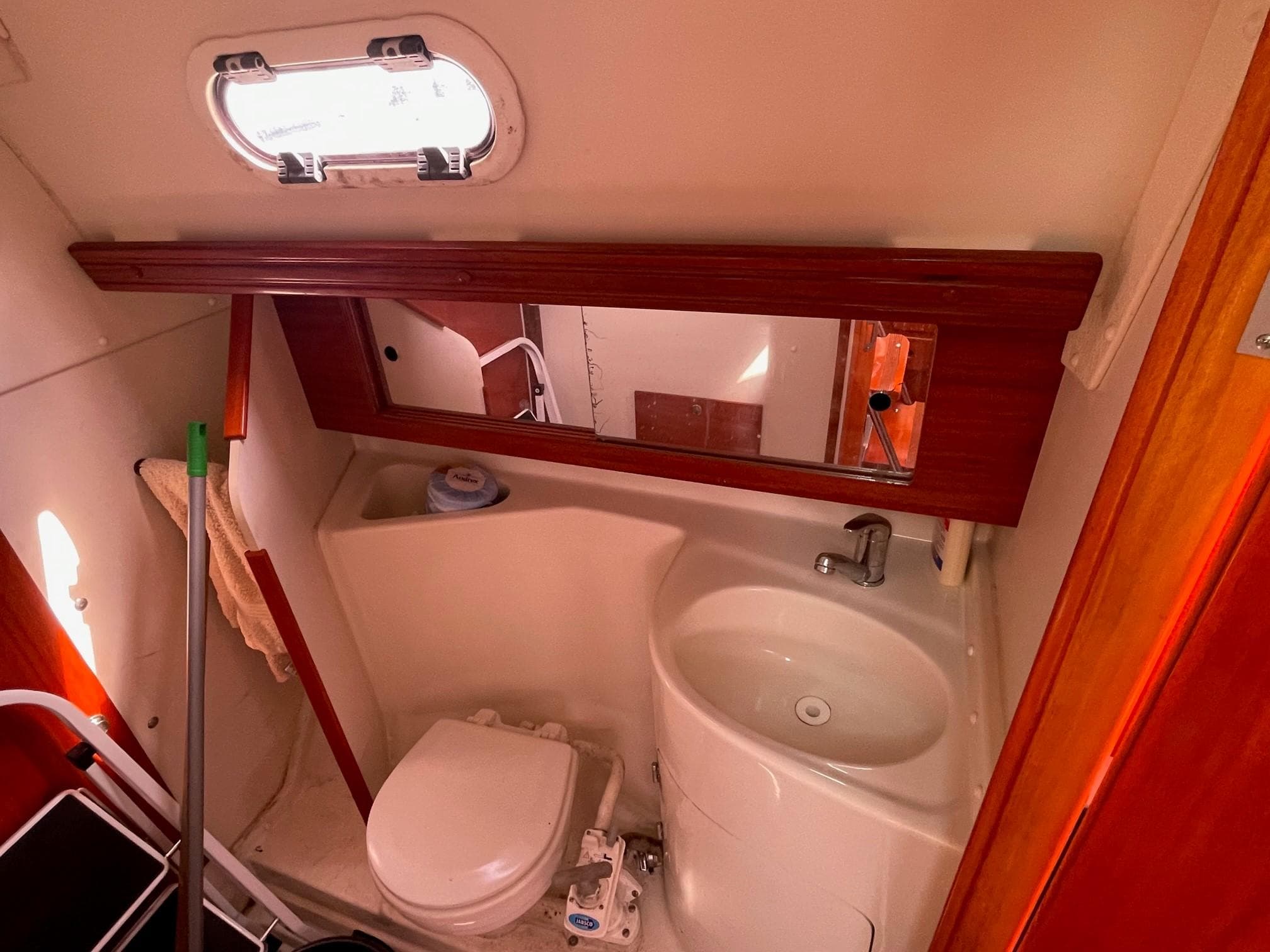 Interior of Hanse 312 yacht, bathroom with toilet and sink.