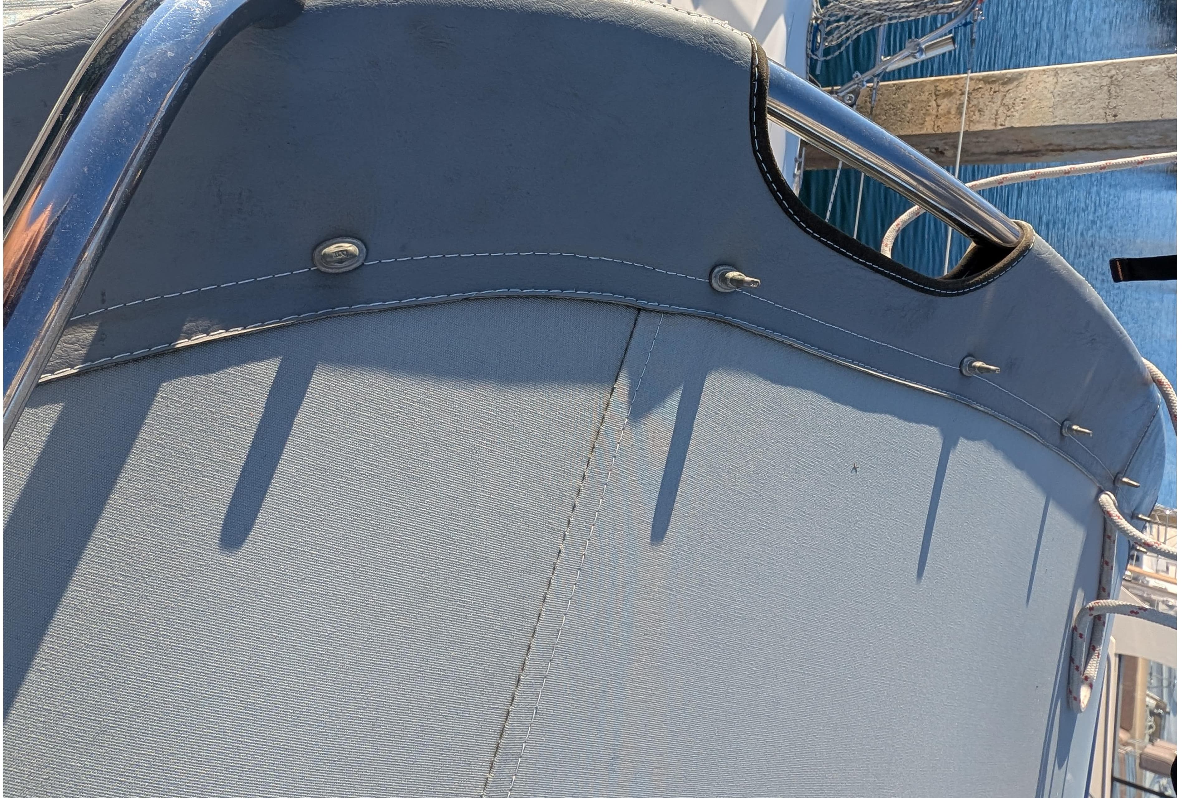 Close-up of a 2003 Catalina 34 MkII sailboat's canvas cover and railing.