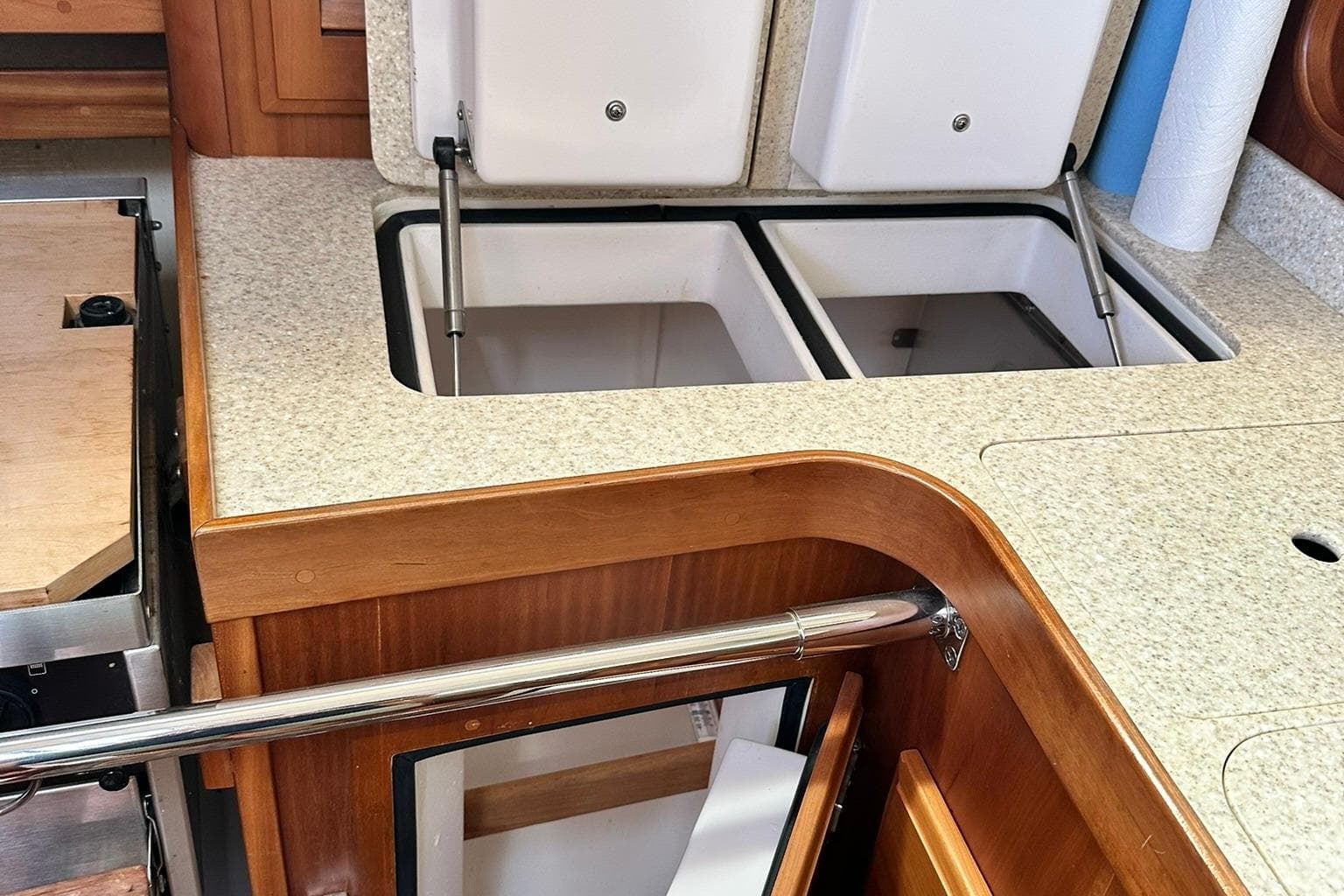 2007 Sabre 386 yacht interior with open storage compartments and wooden cabinetry.