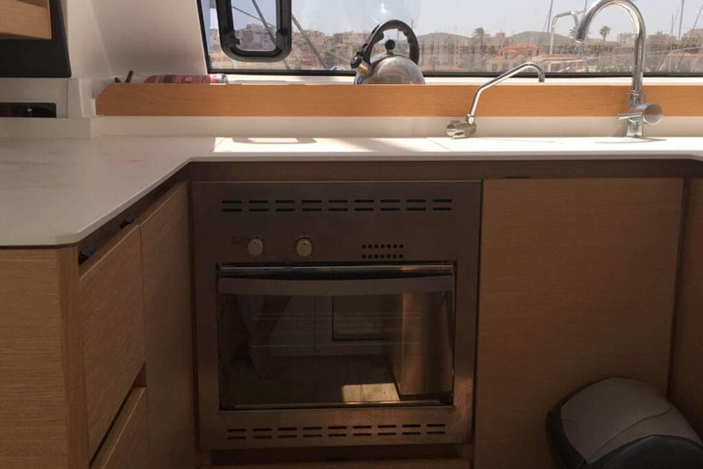 Modern kitchen in 2016 Nautitech 40 Open yacht with oven and sink.