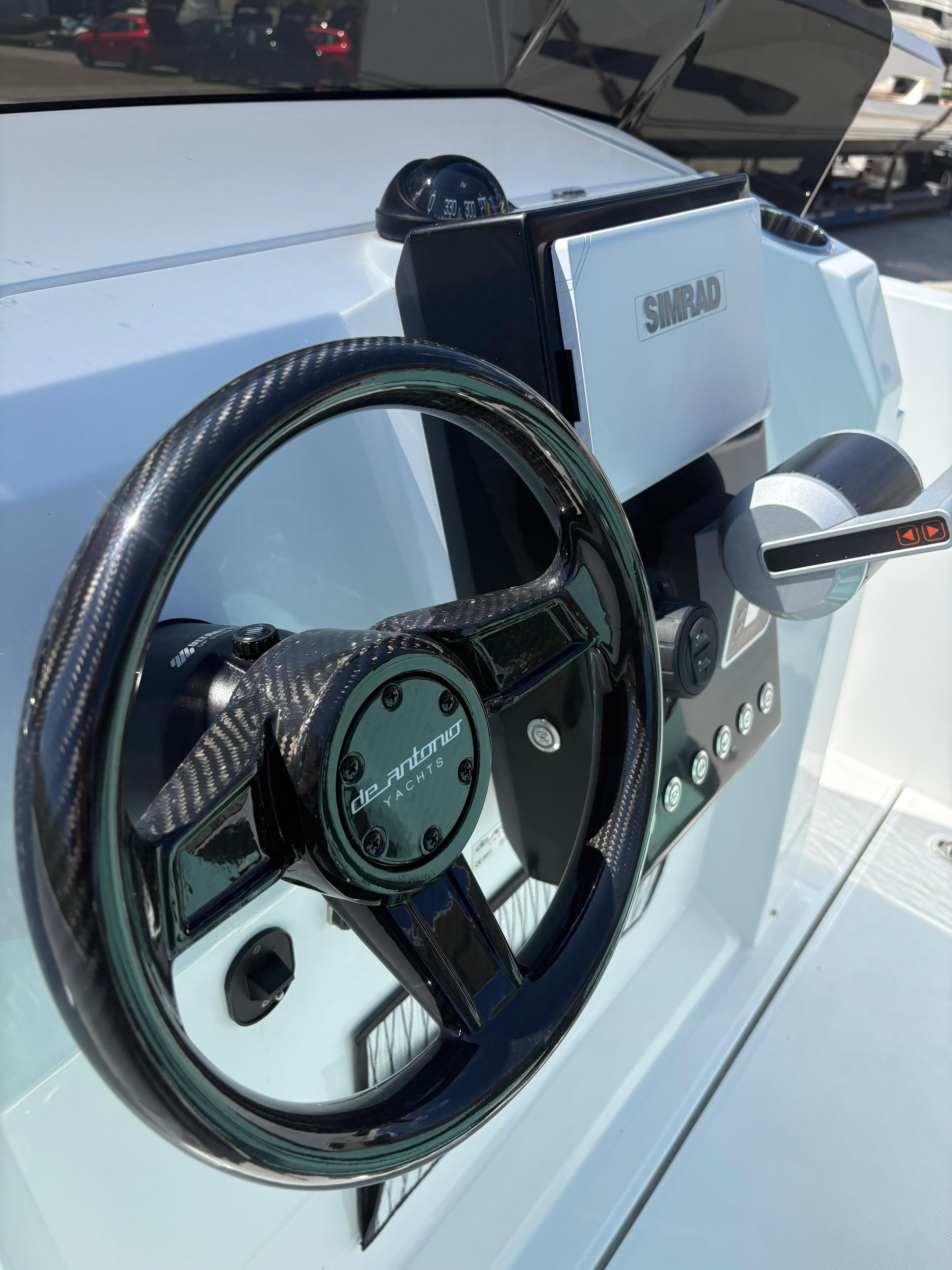 Steering wheel and controls of 2025 De Antonio Yachts e23 Open.