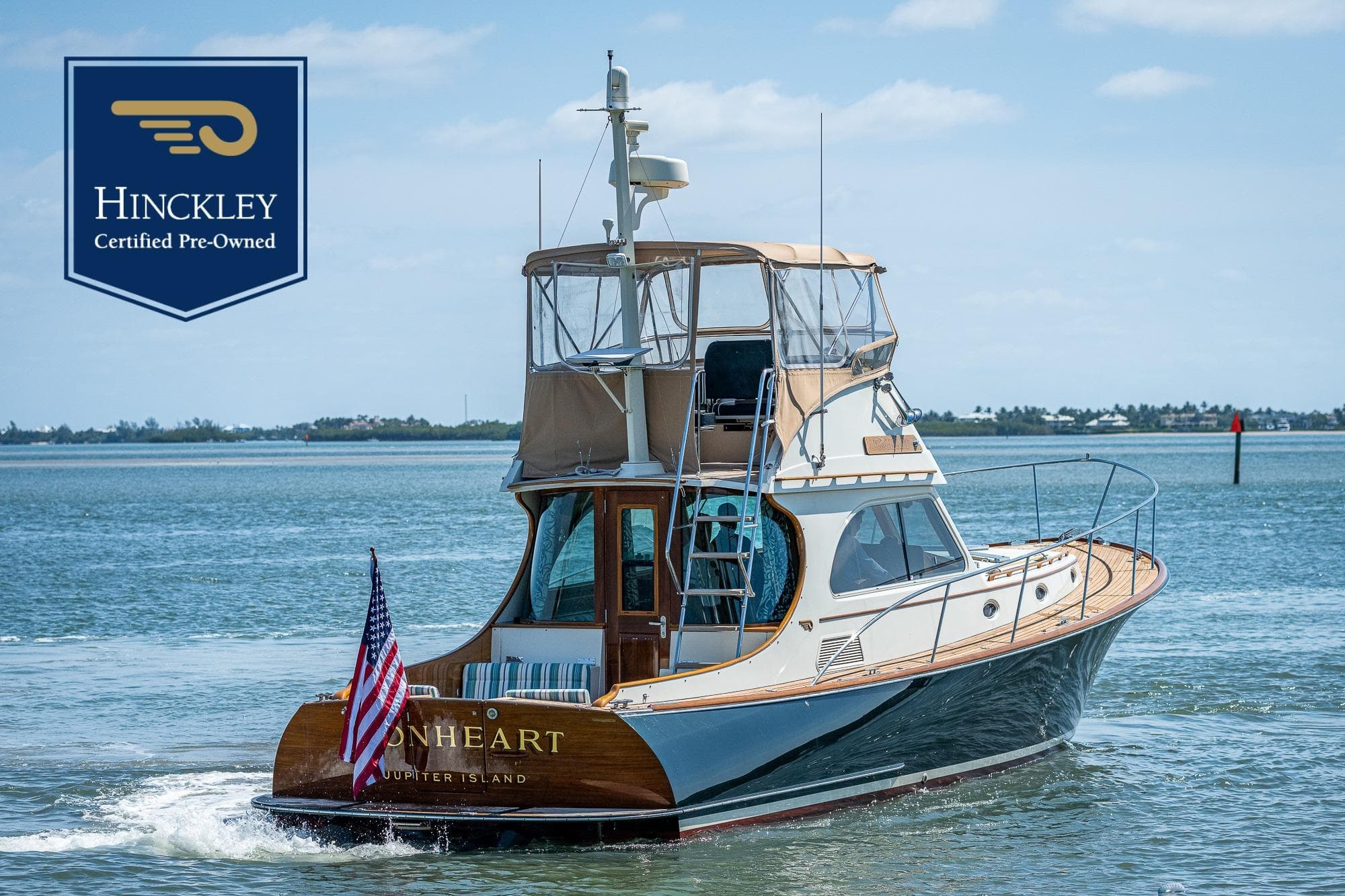 Hinckley Talaria 44 MKII Flybridge 2008 cruising on water, certified pre-owned.