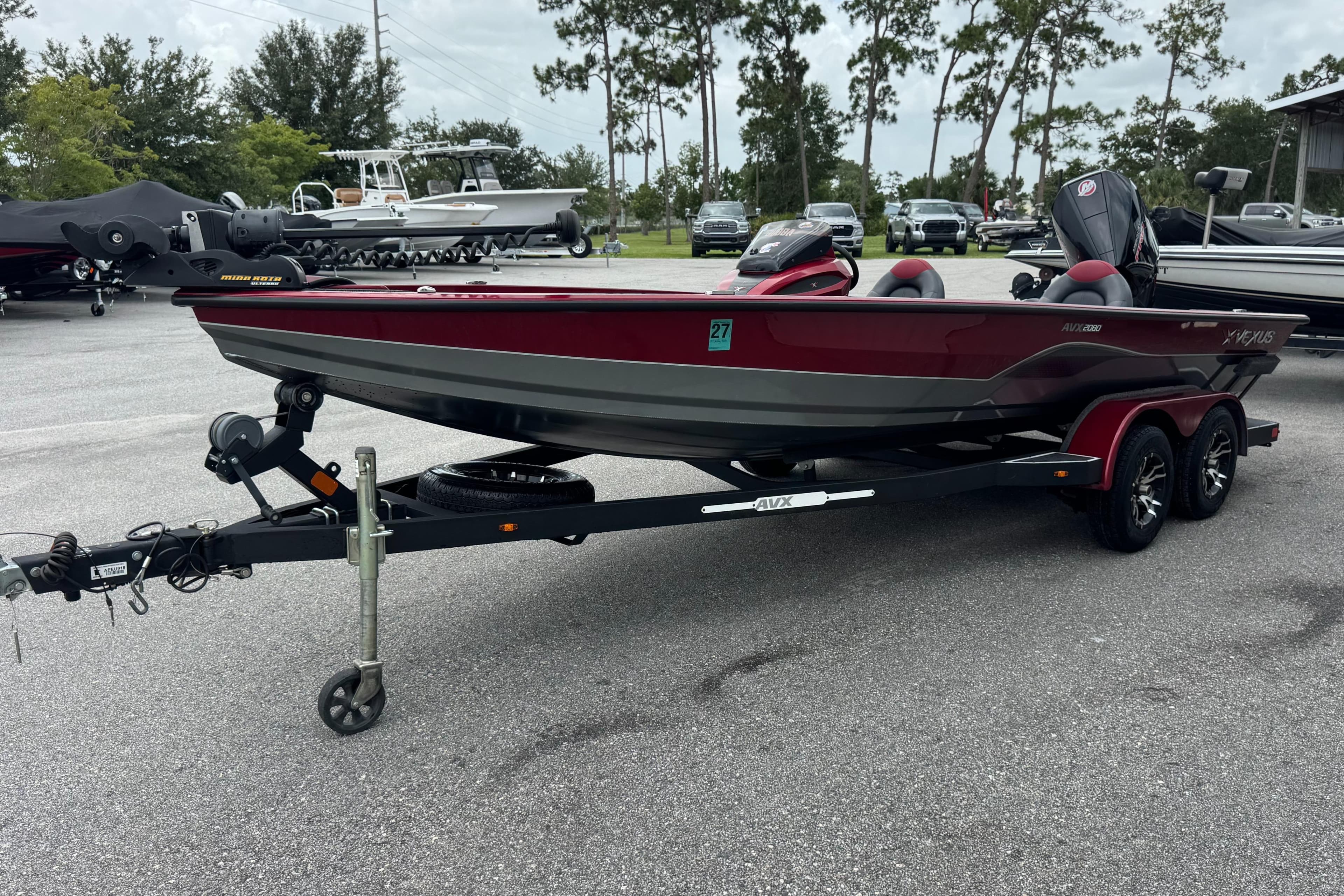 2022 Vexus AVX2080 boat on trailer, parked outdoors.