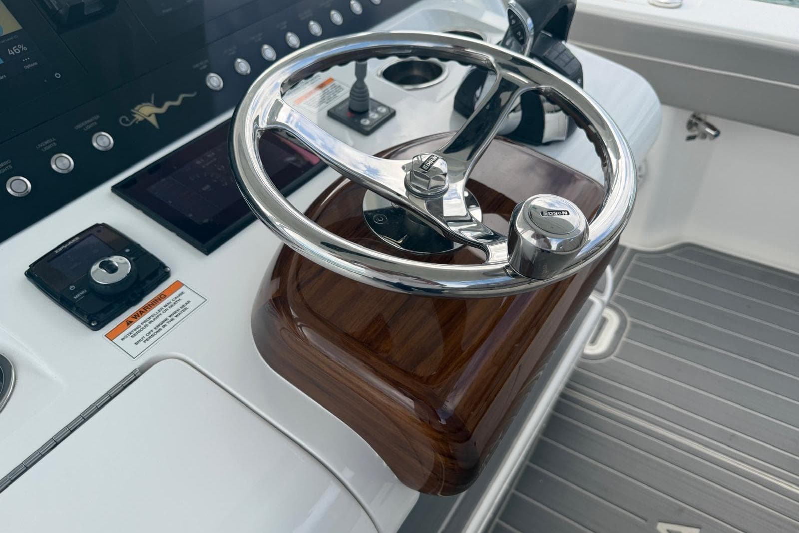 Steering wheel of 2021 Valhalla Boatworks V-33, featuring sleek design and modern controls.