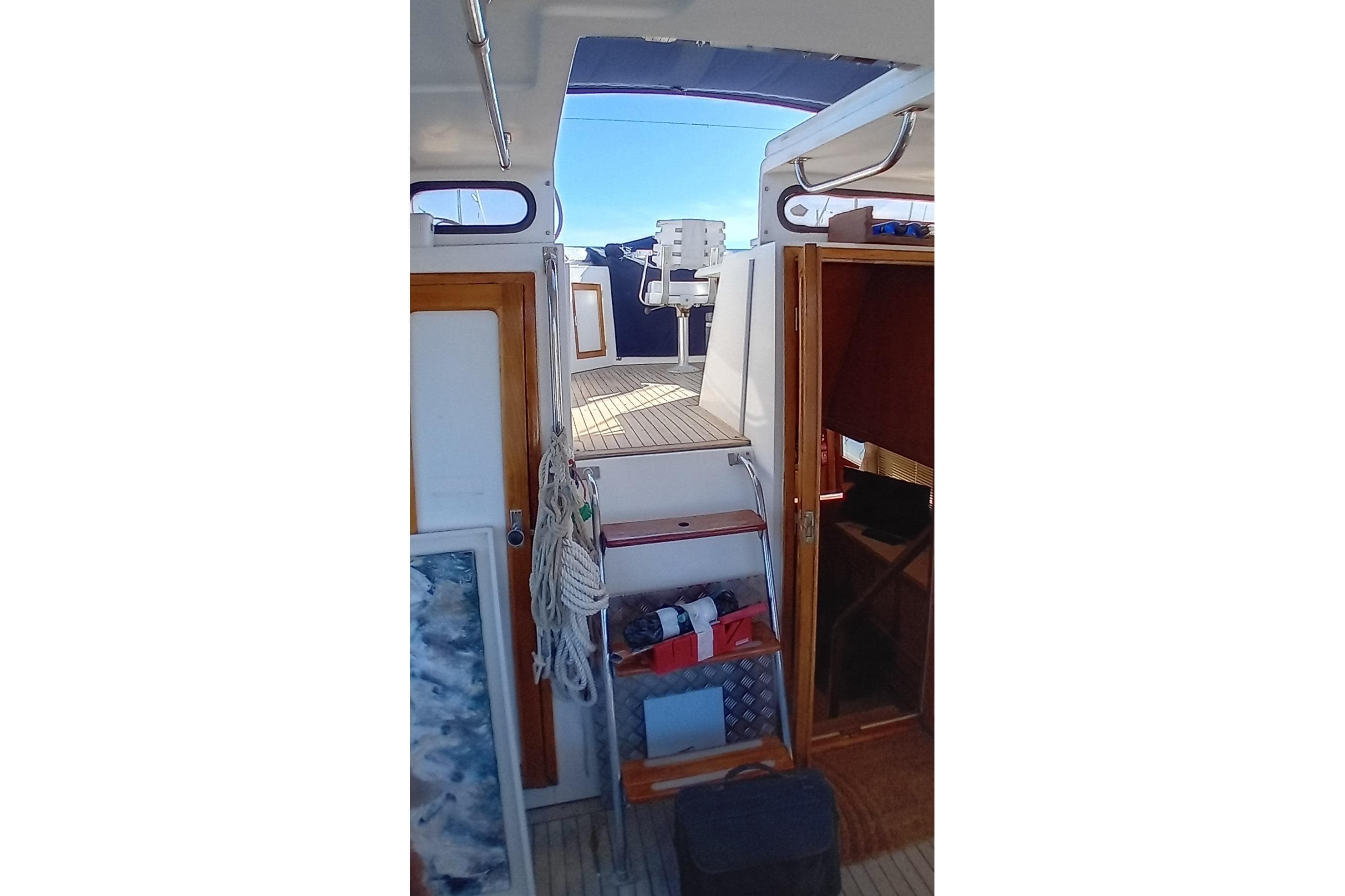 Interior view of 1992 Horizon Yachts Trawler Yacht, featuring wooden doors and nautical equipment.