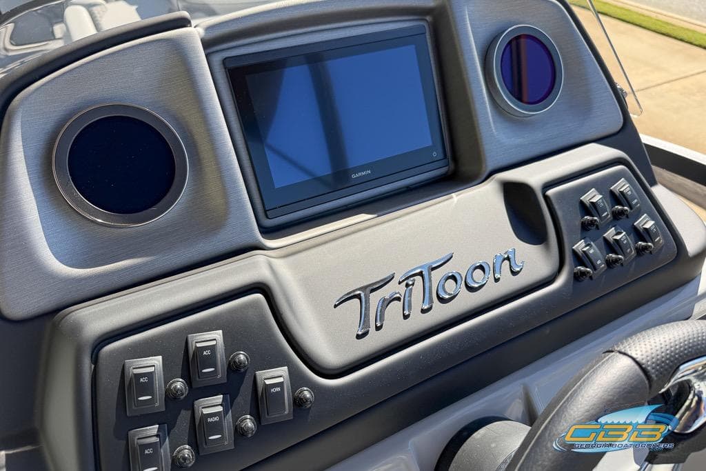 Dashboard of 2026 JC 25 Neptoon LG pontoon boat with controls and display.
