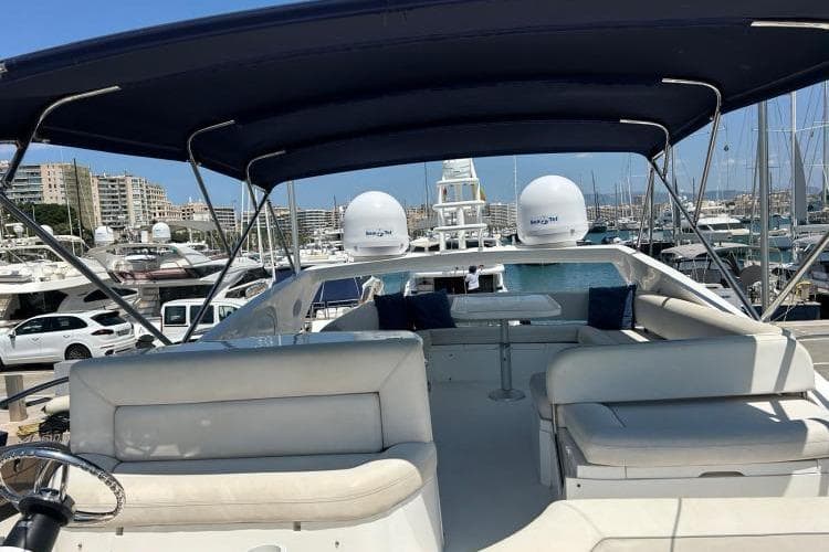 2008 Sunseeker Manhattan 60 yacht with spacious deck and seating, docked in a marina.