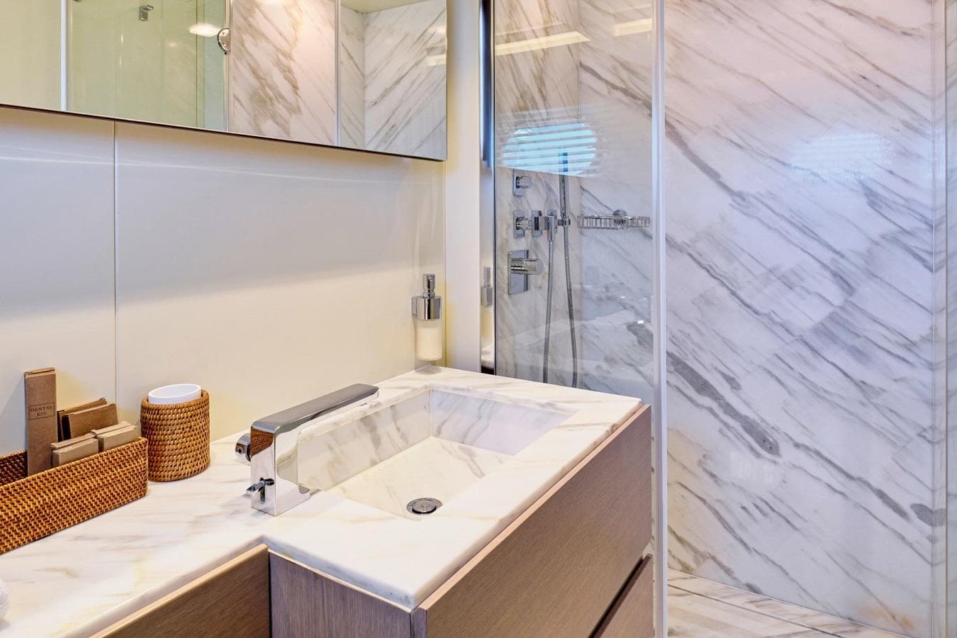 Luxurious marble bathroom in 2008 Admiral 25 yacht, featuring modern fixtures and elegant design.