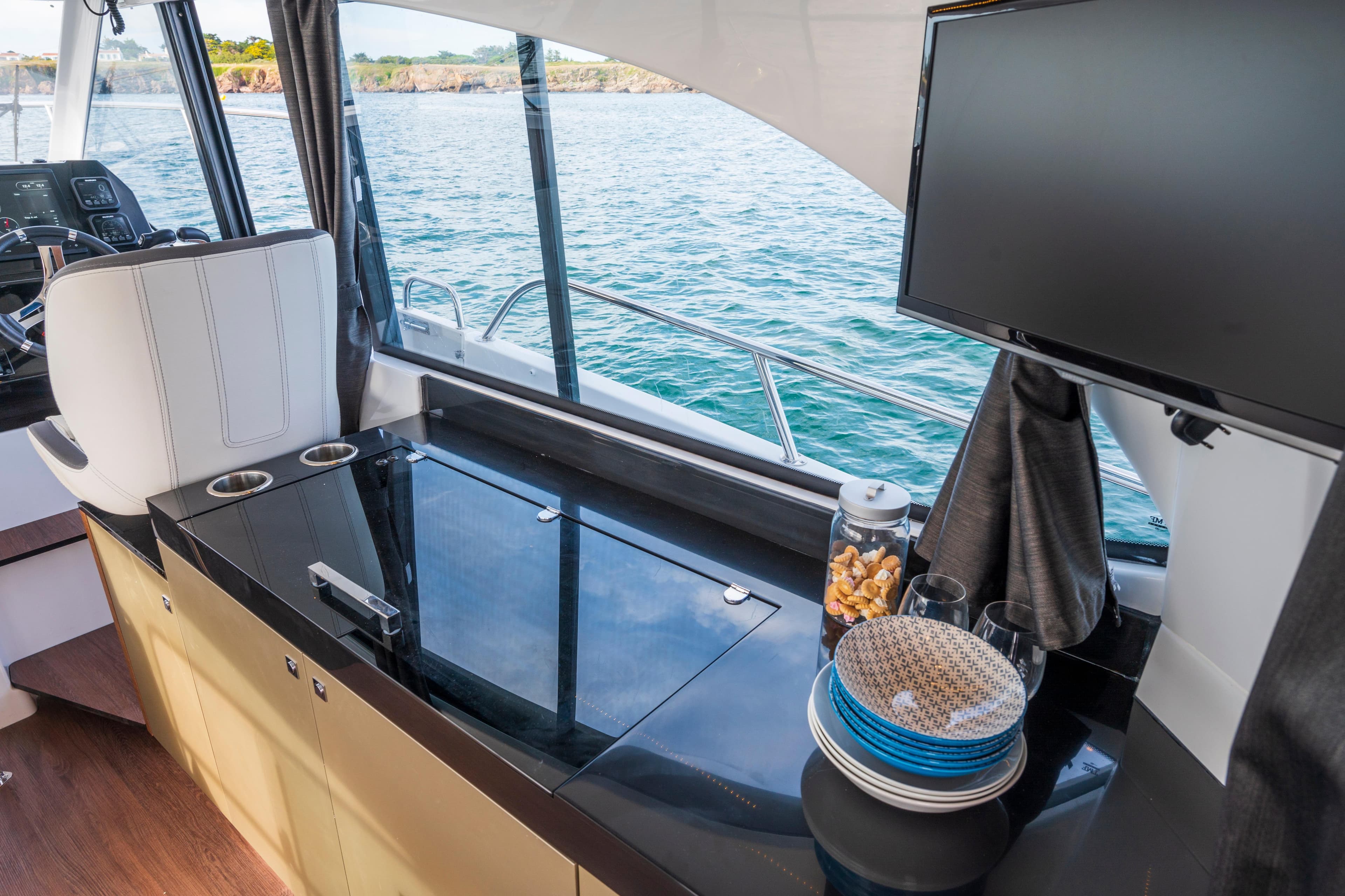 Interior of 2026 Beneteau Antares 11 Coupe with modern amenities and ocean view.