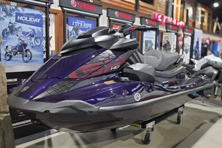 2026 Yamaha WaveRunner GP HO jet ski displayed in showroom, sleek design, vibrant purple color.